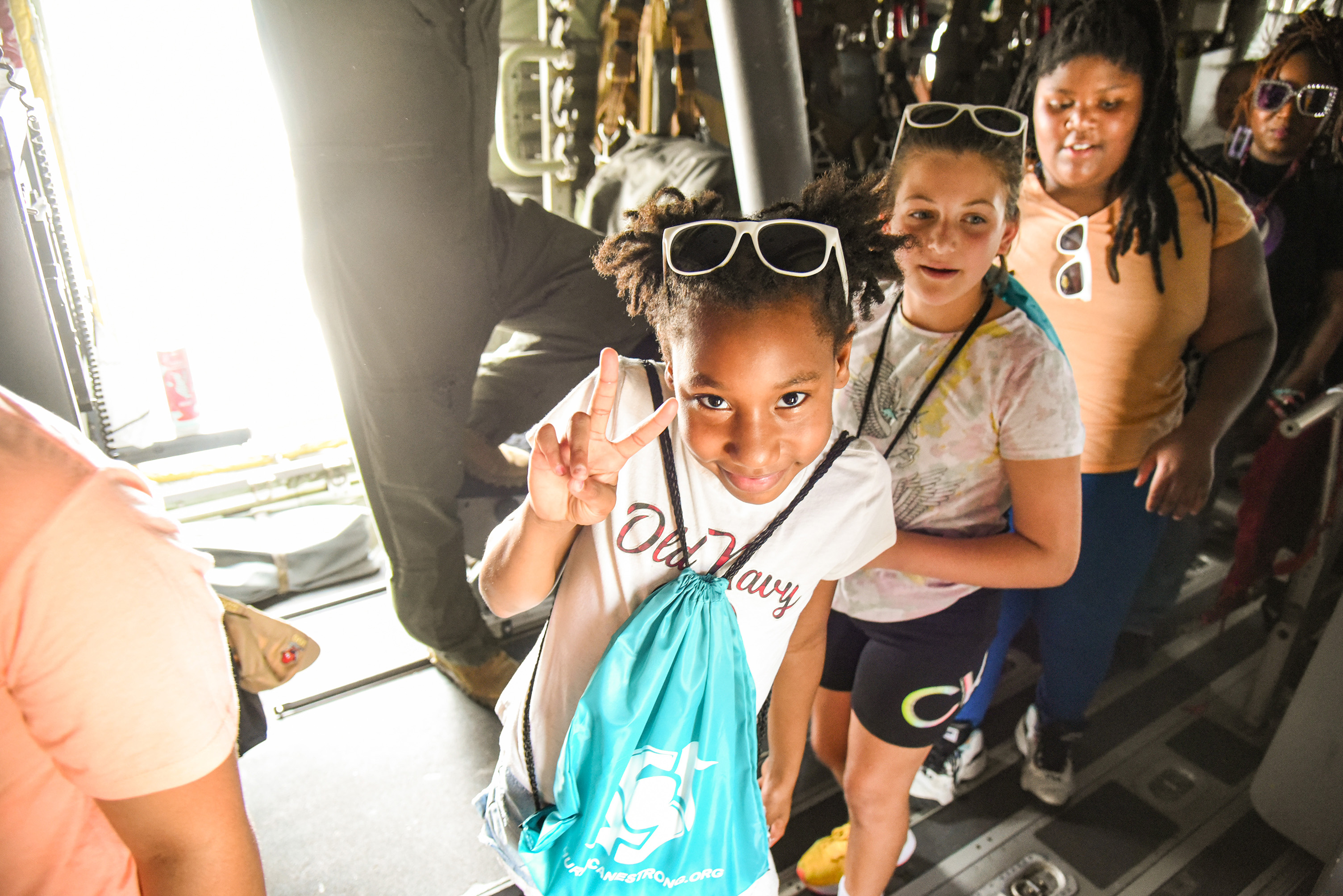 students walking through aircraft