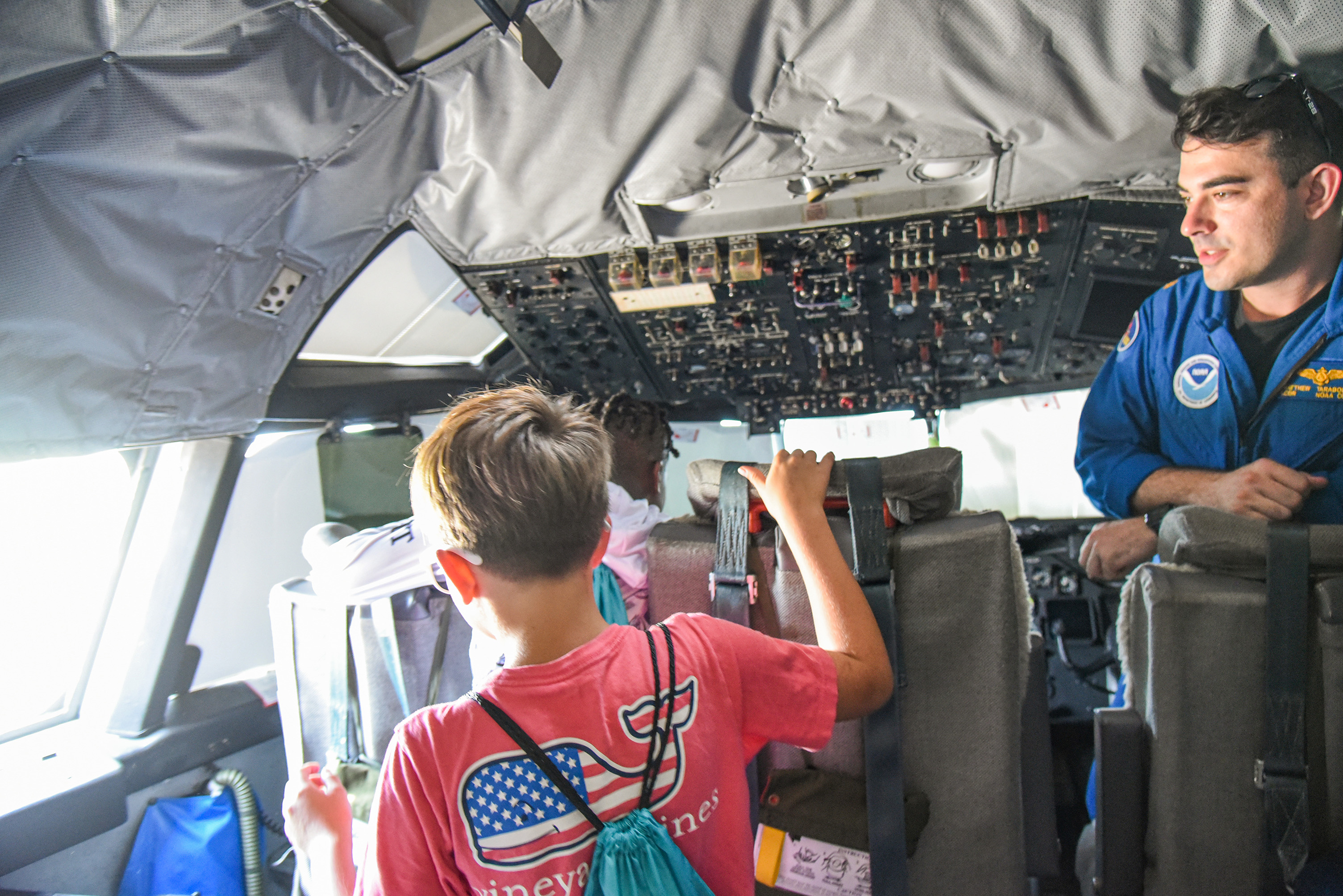 students walking through plane