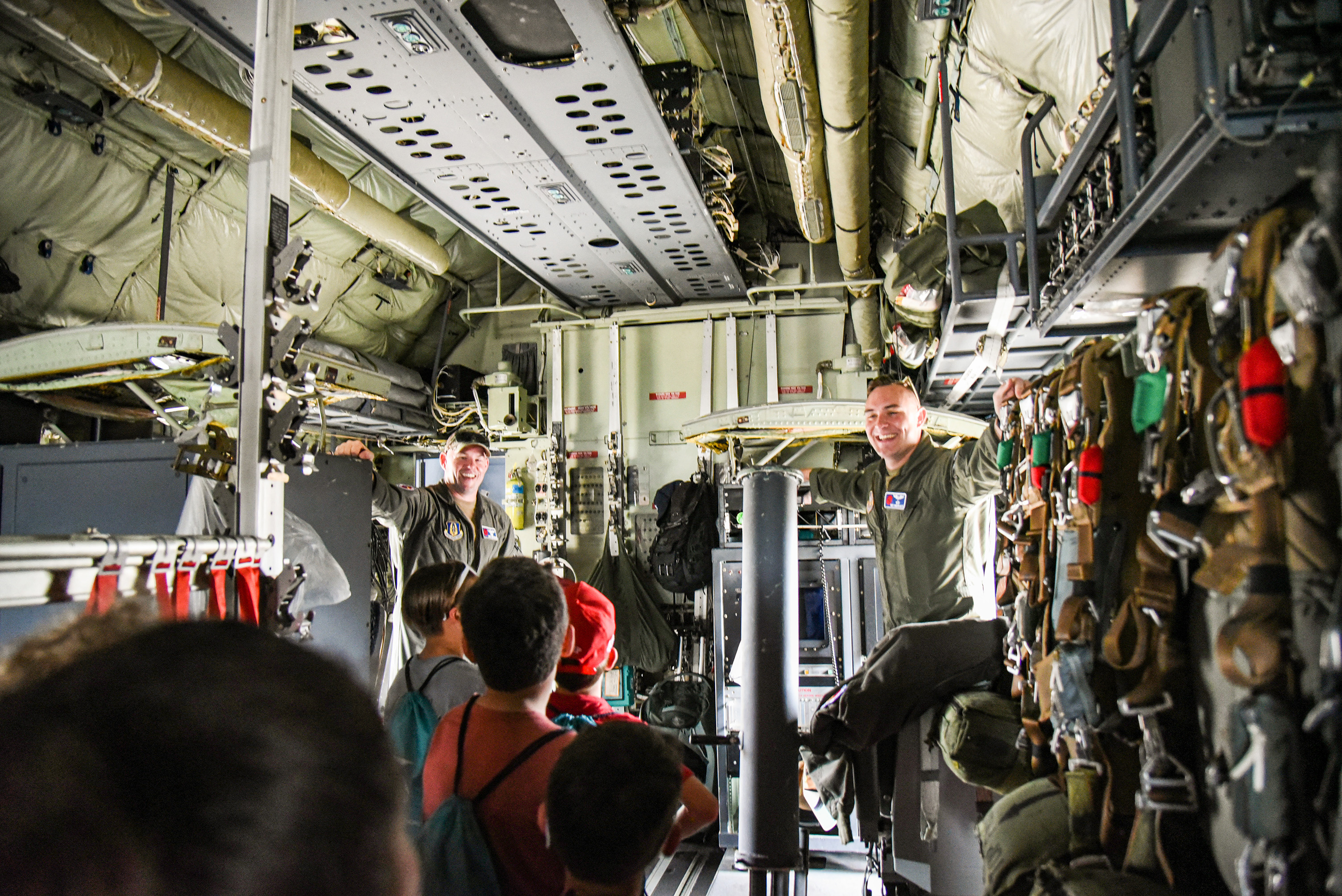 students walking through aircraft
