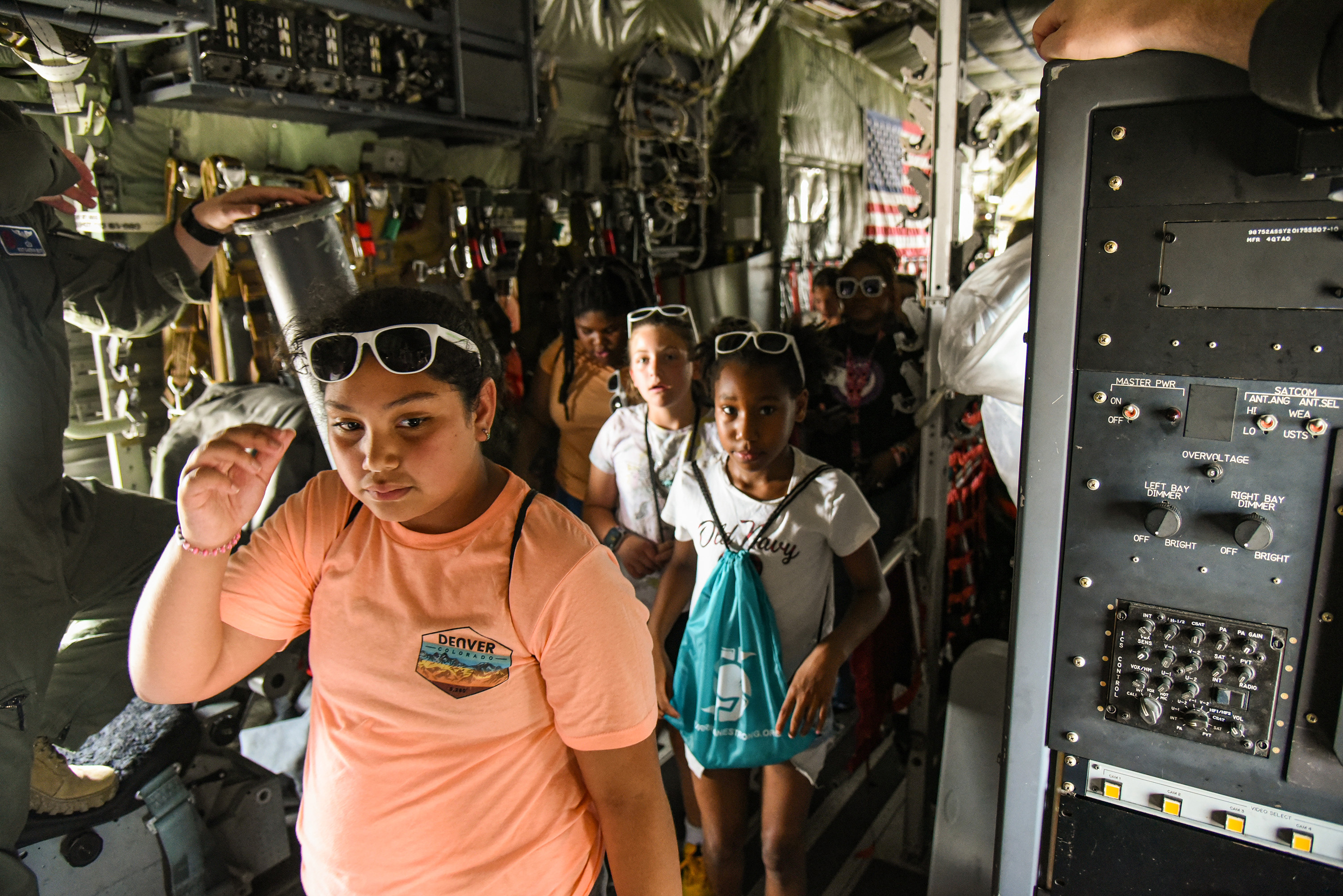 students walking through aircraft