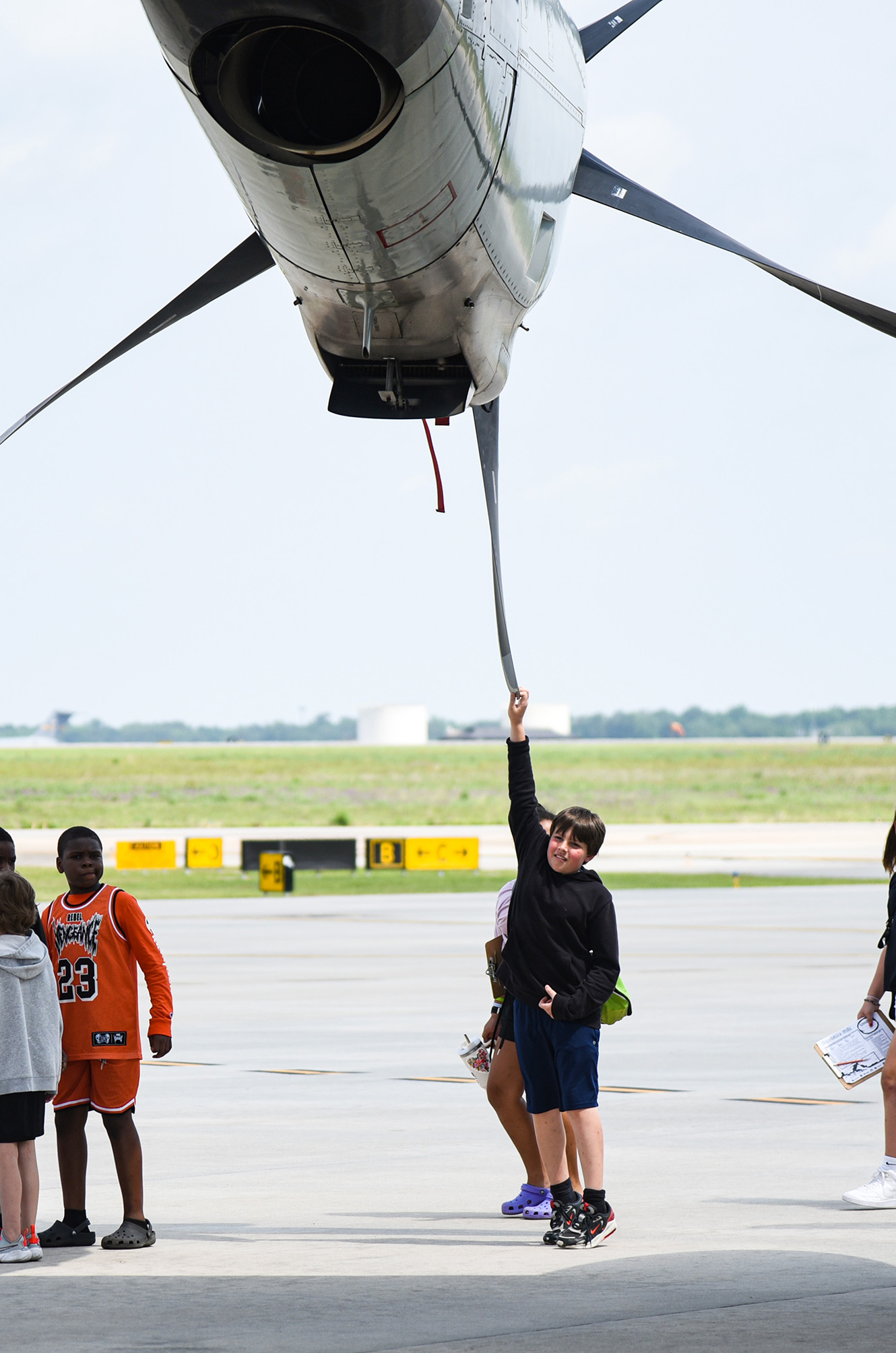 students gathering outside second plane