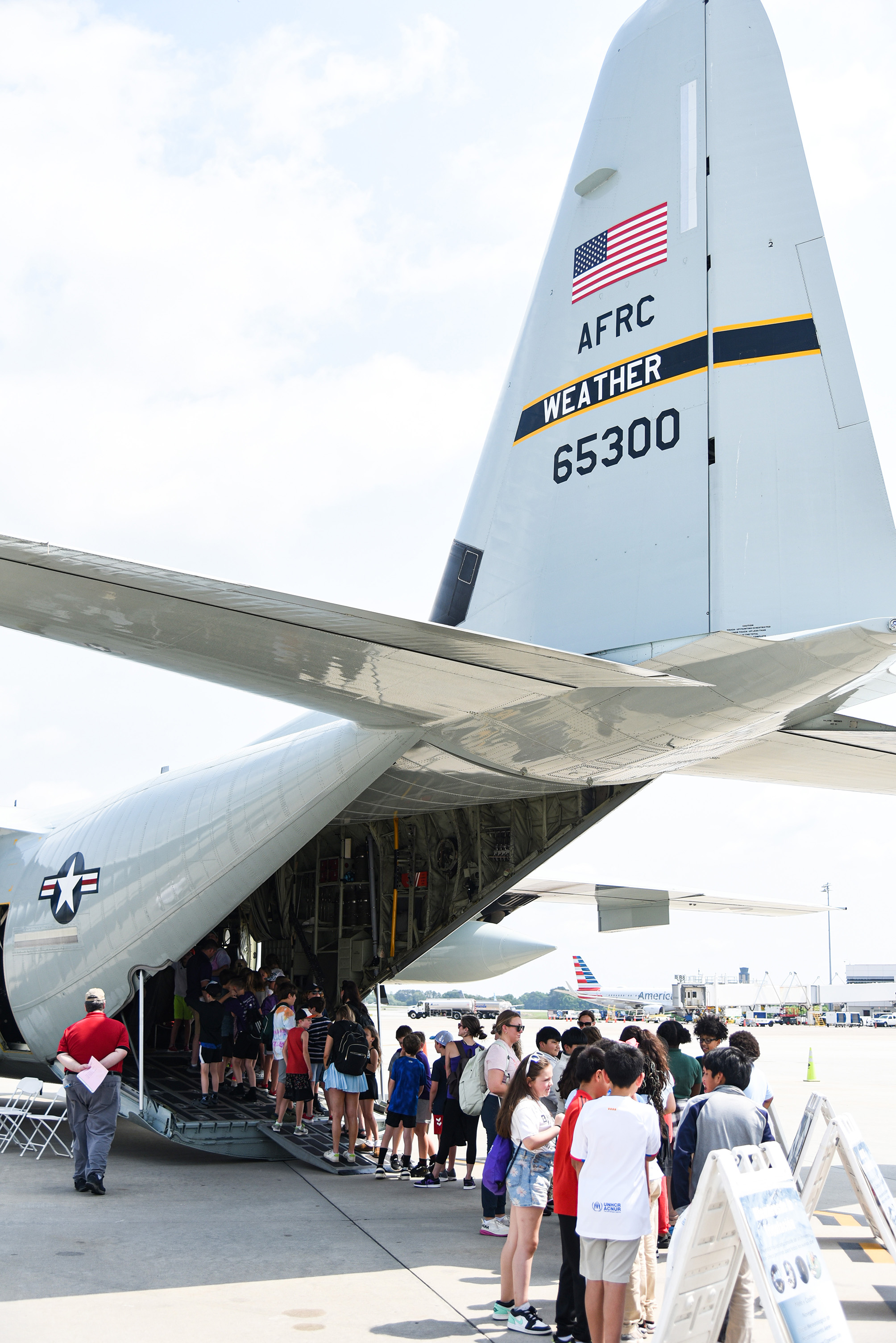 students gathering outside second plane