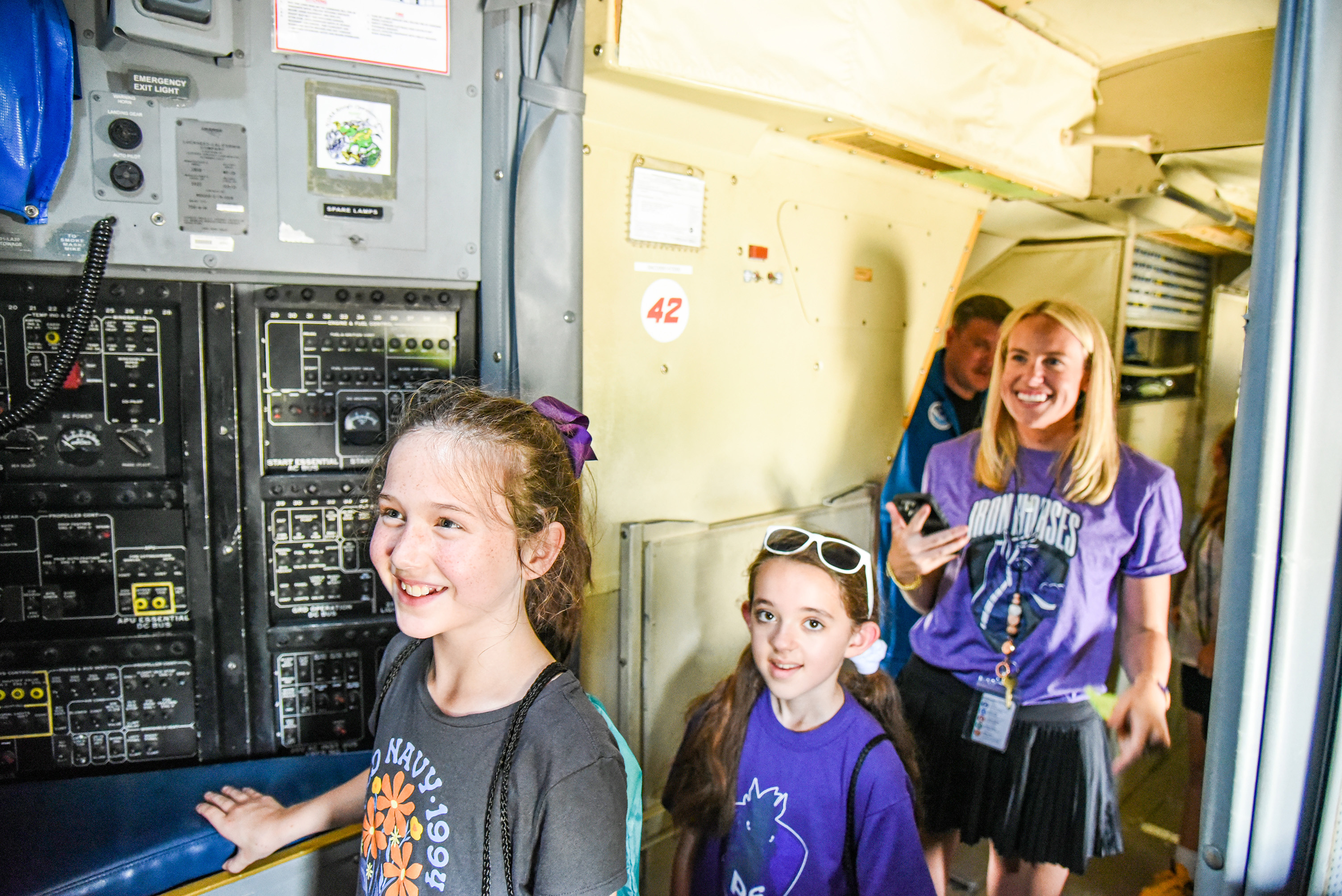 students walking through plane