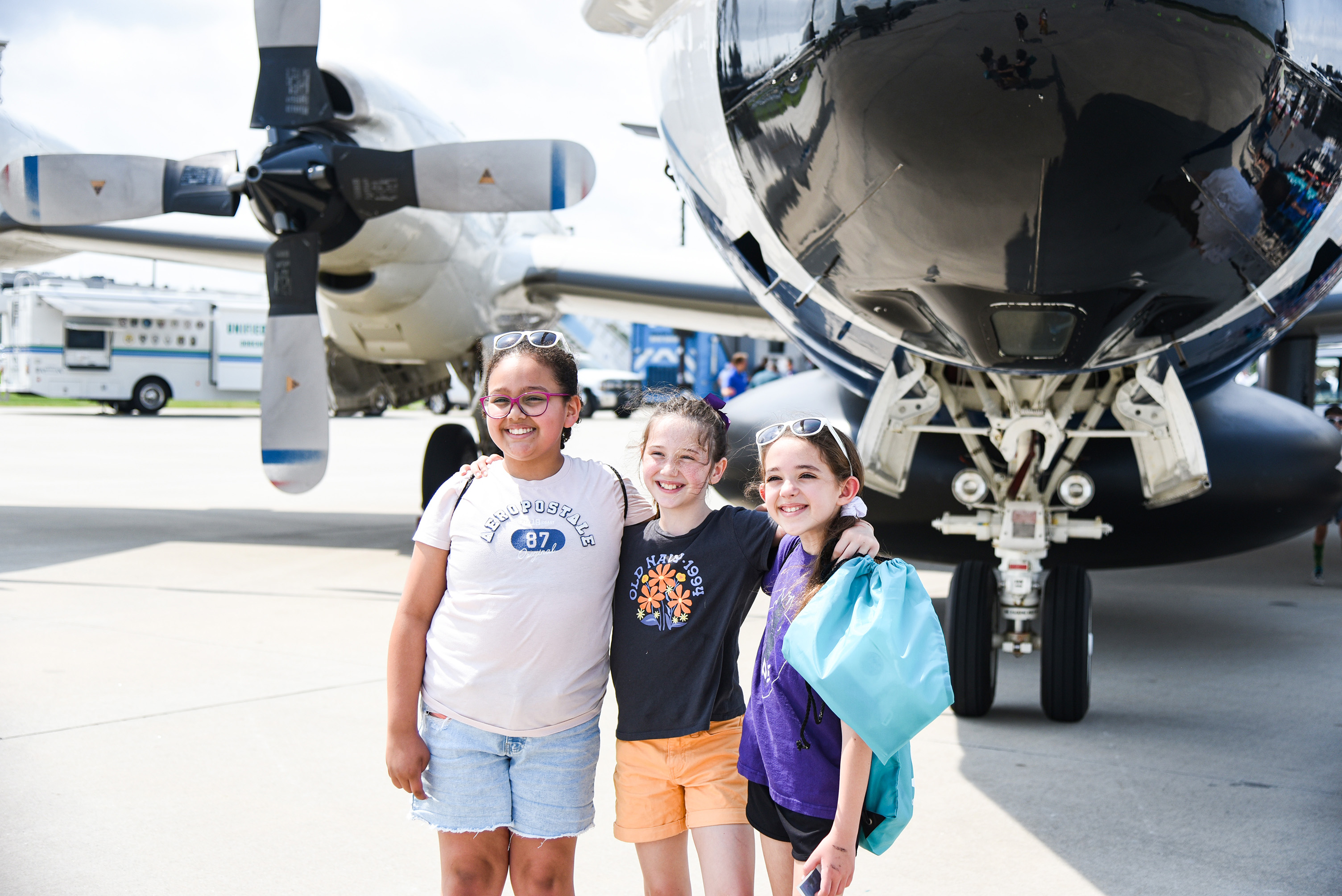 students underneath propellers