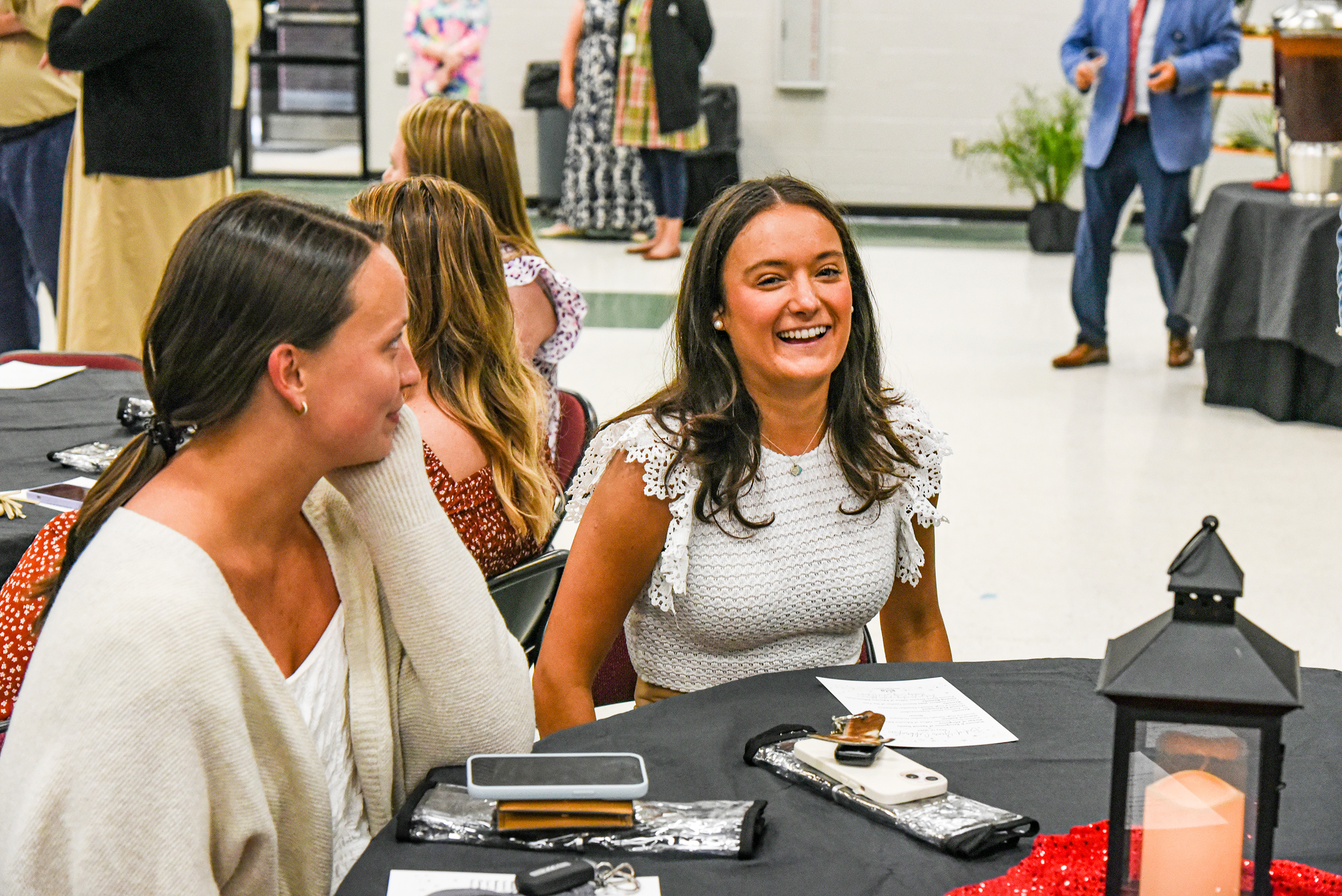 teachers smiling at table