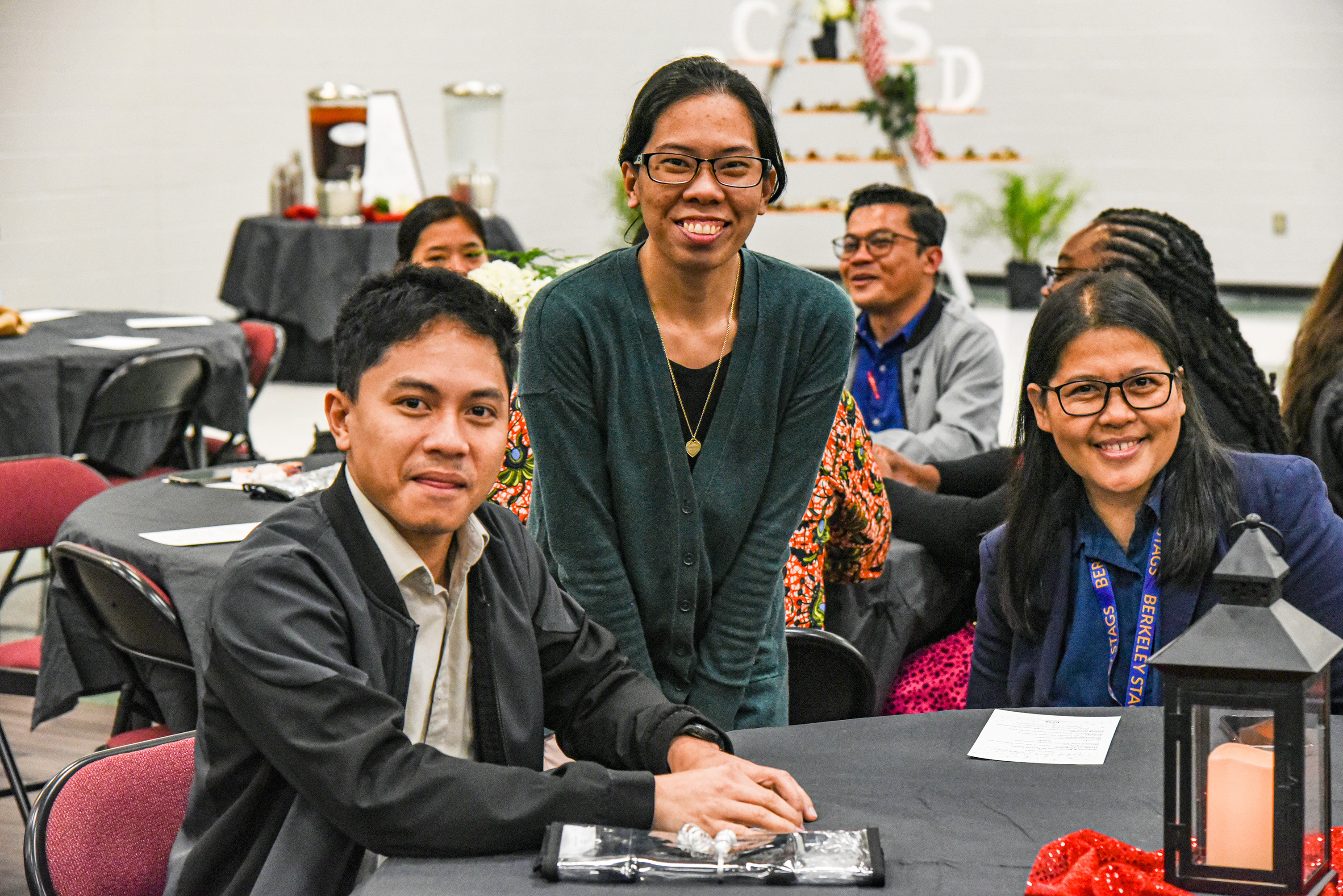 teachers smiling at table
