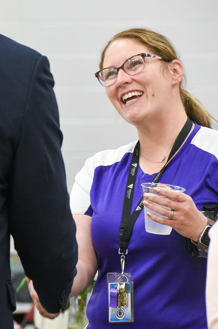 teacher shaking admin hand