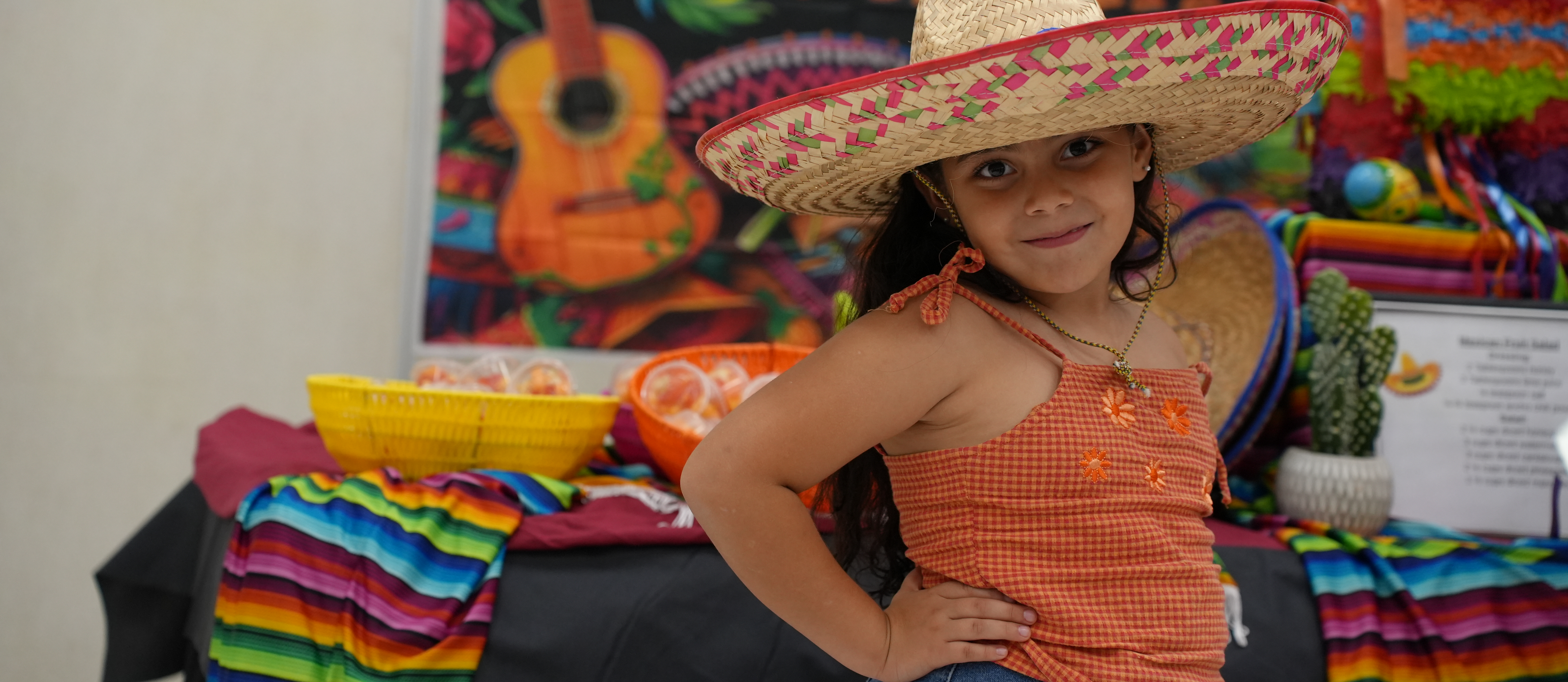 Hispanic girl wearing a sombrero