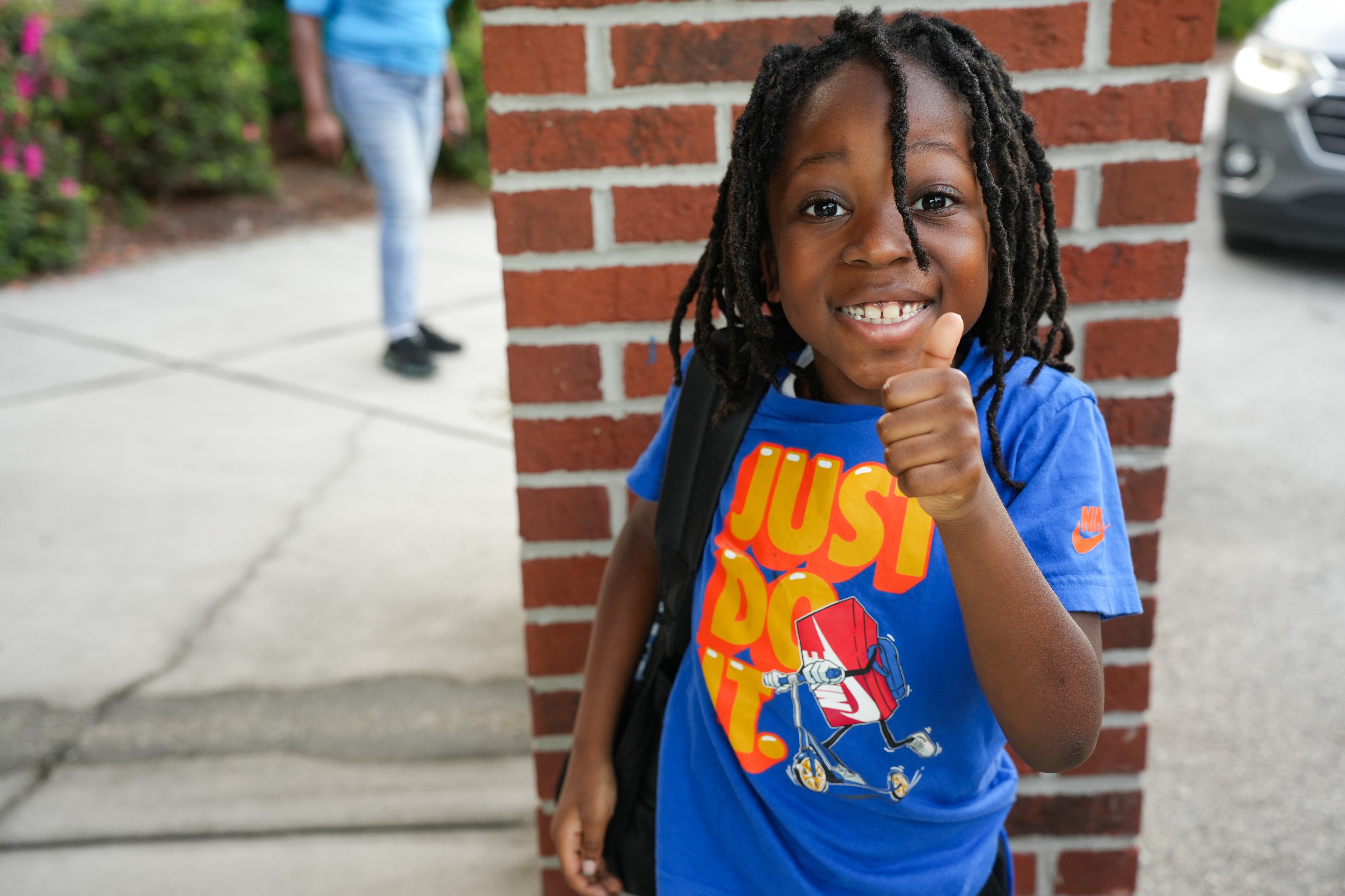 kid giving thumbs up