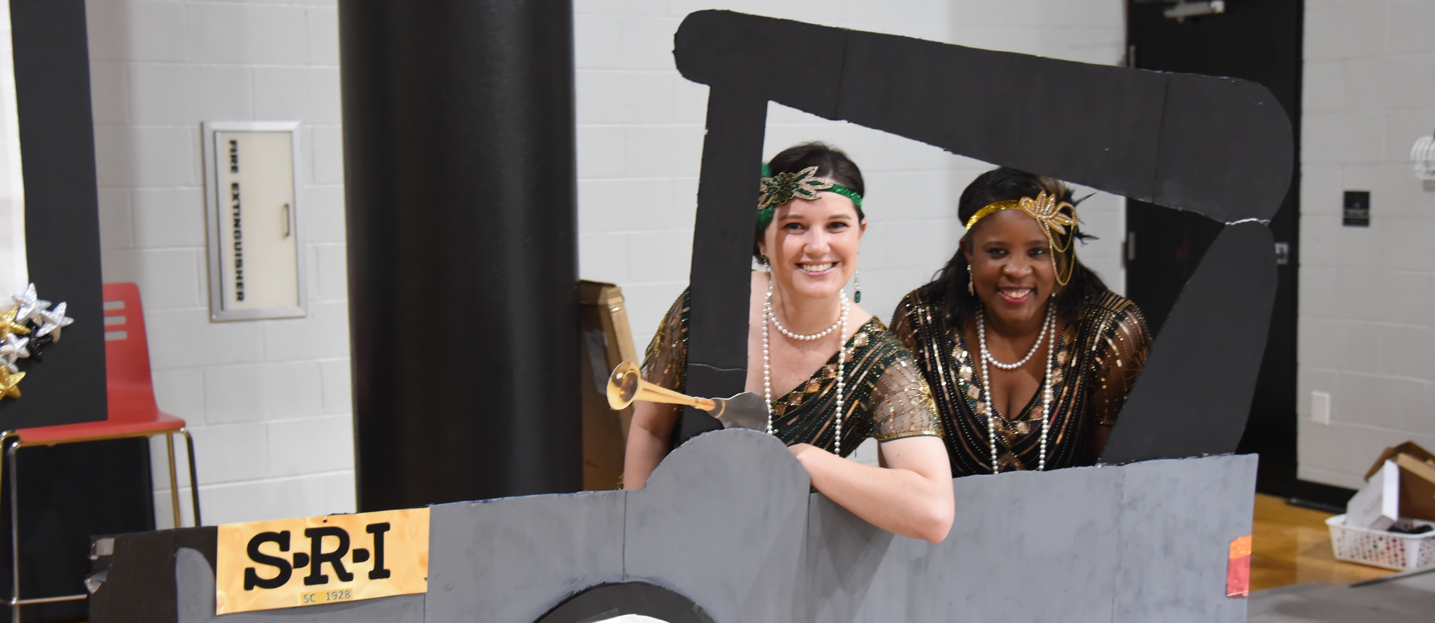 SRI school administration in cardboard cut out car