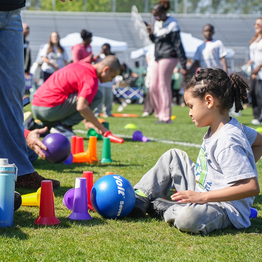SHS student and young student playing