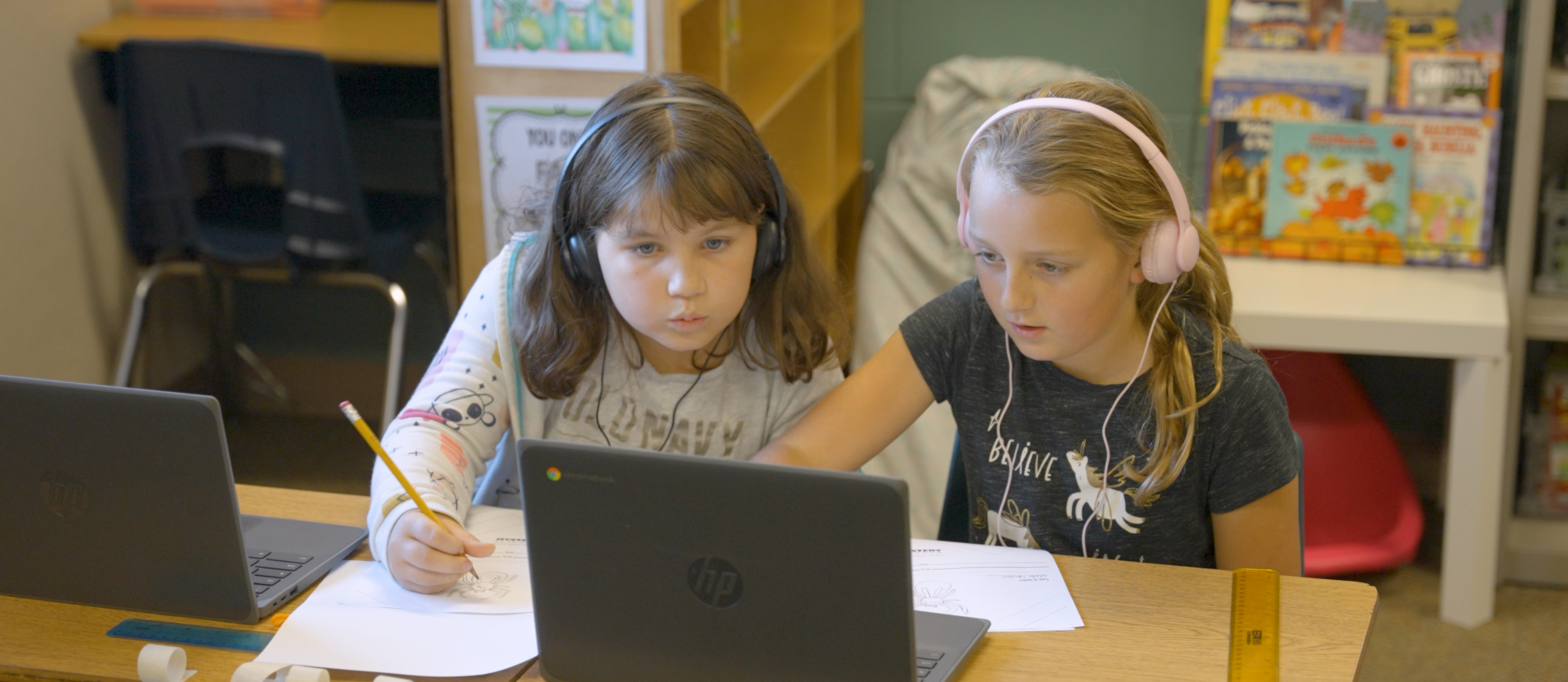 Students collaborating on chromebooks