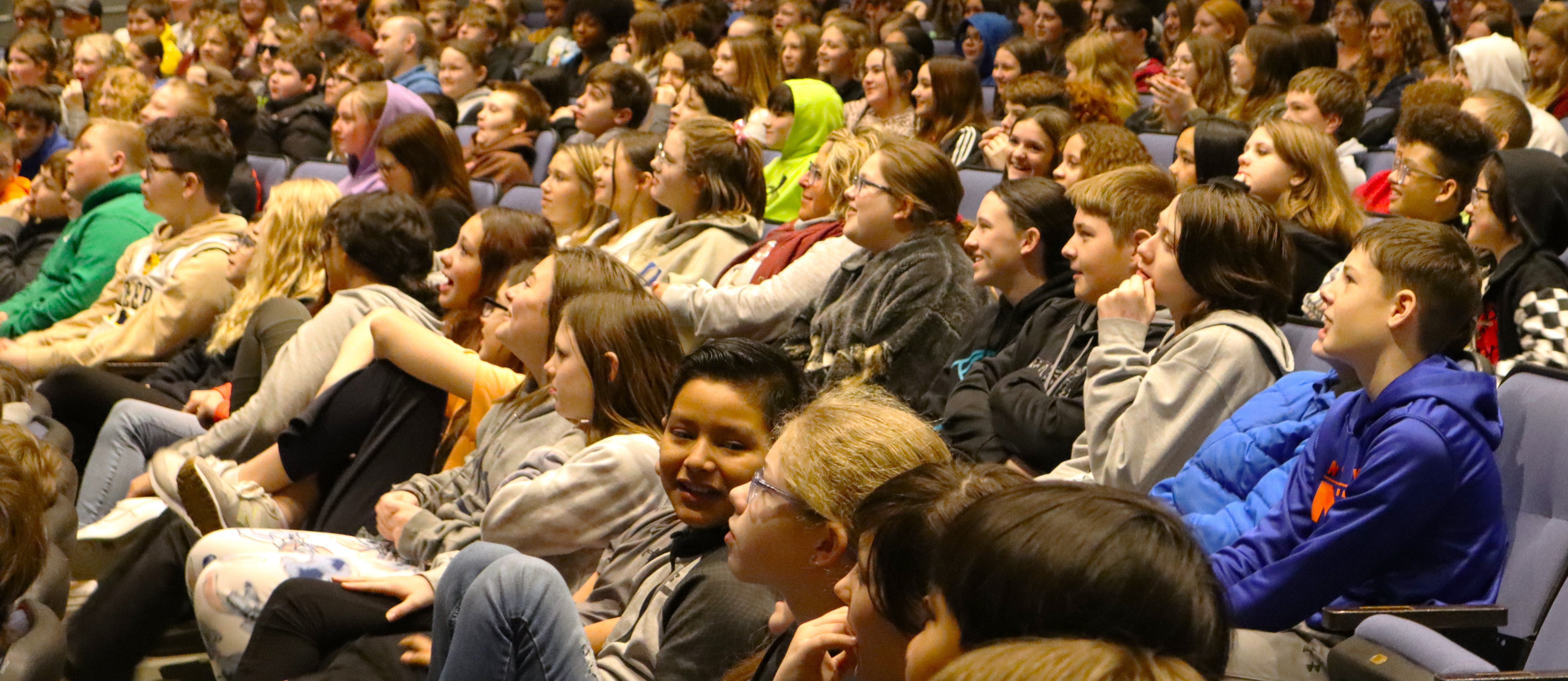 OMS students and staff sitting during an awards assembly