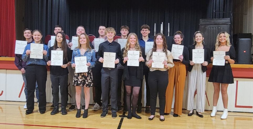 national honor society team holding certificate
