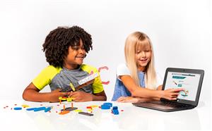 two kids playing with the laptop