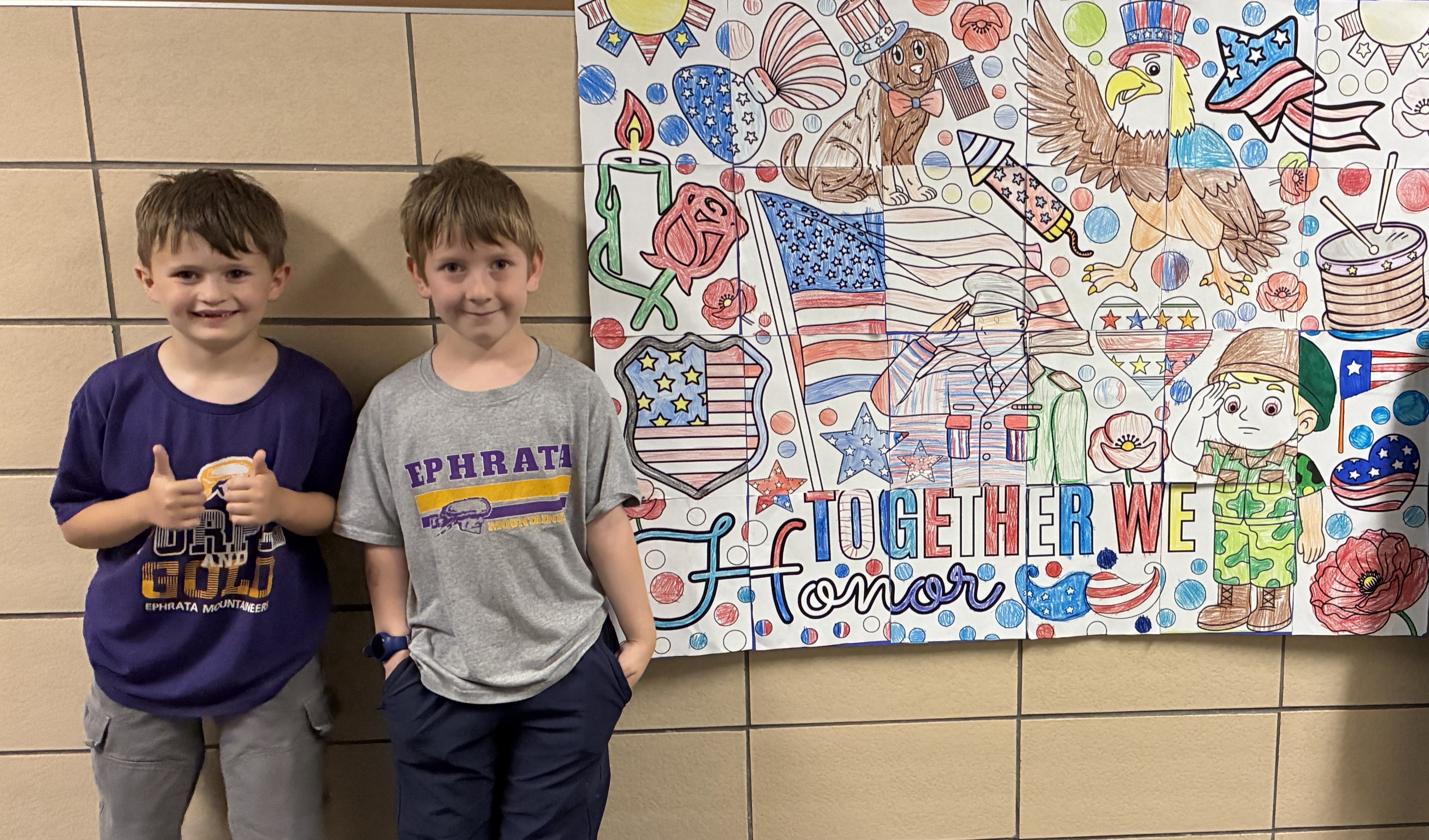 Akron students with Memorial Day sign