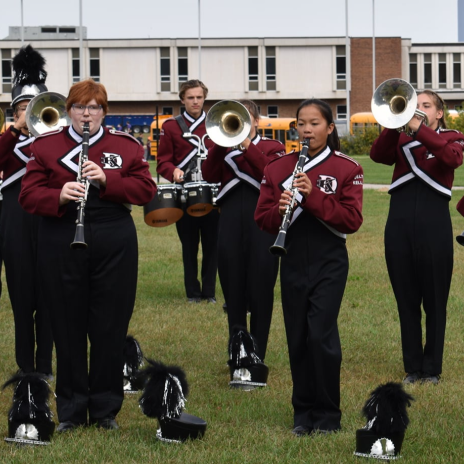 Delton Kellogg Marching  Band practicing their instruments.