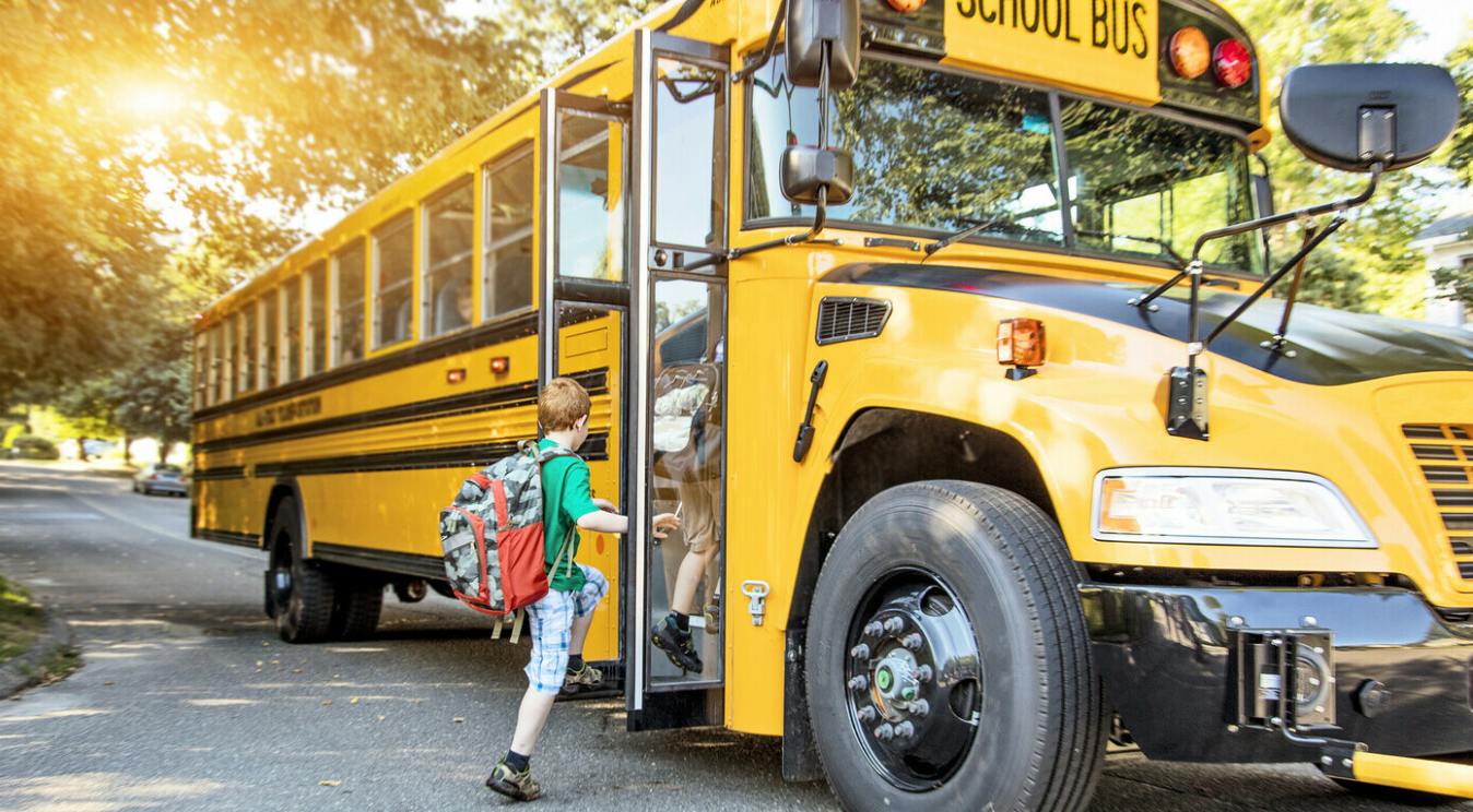 Student boarding a school bus