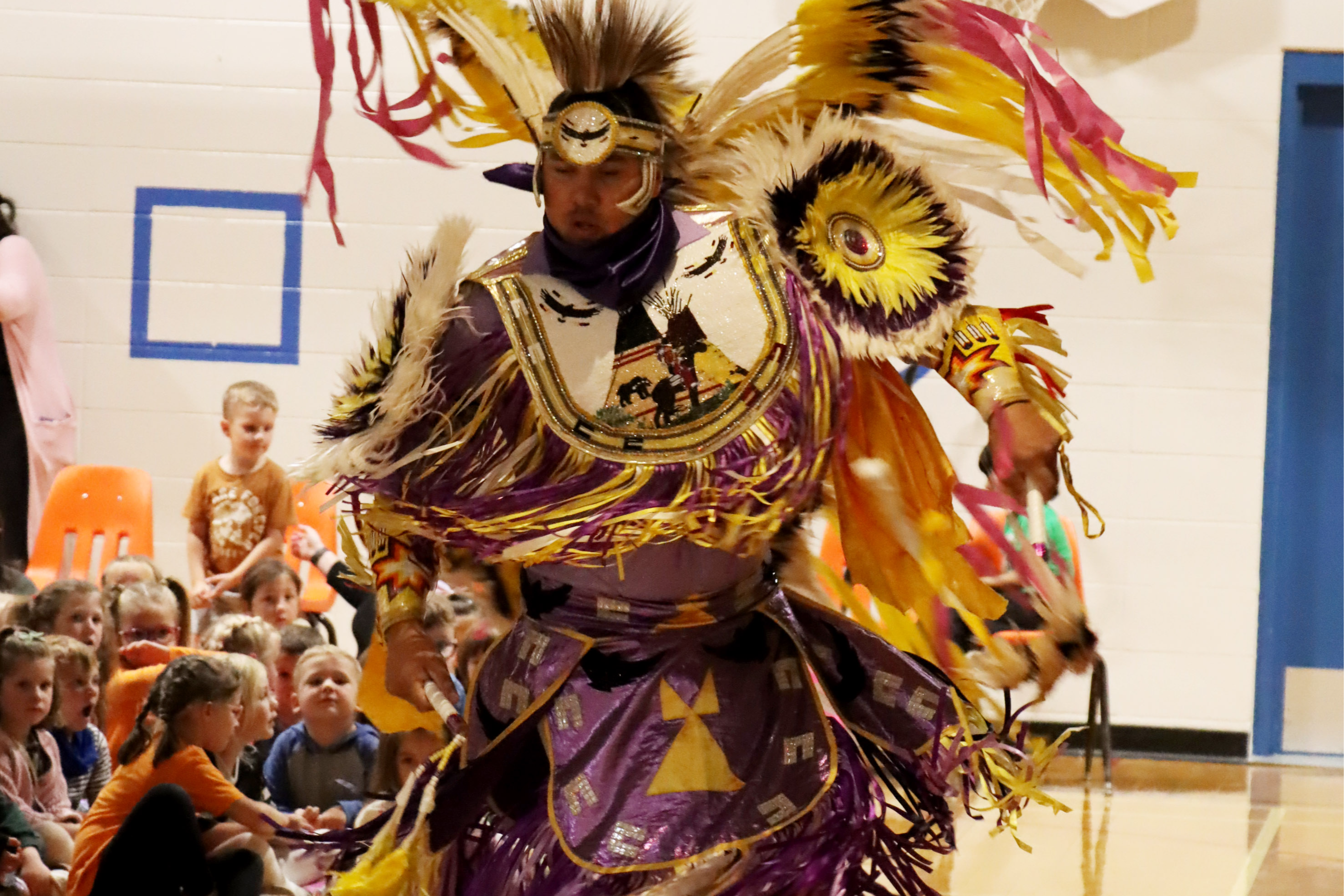 Indigenous dancer performing at school