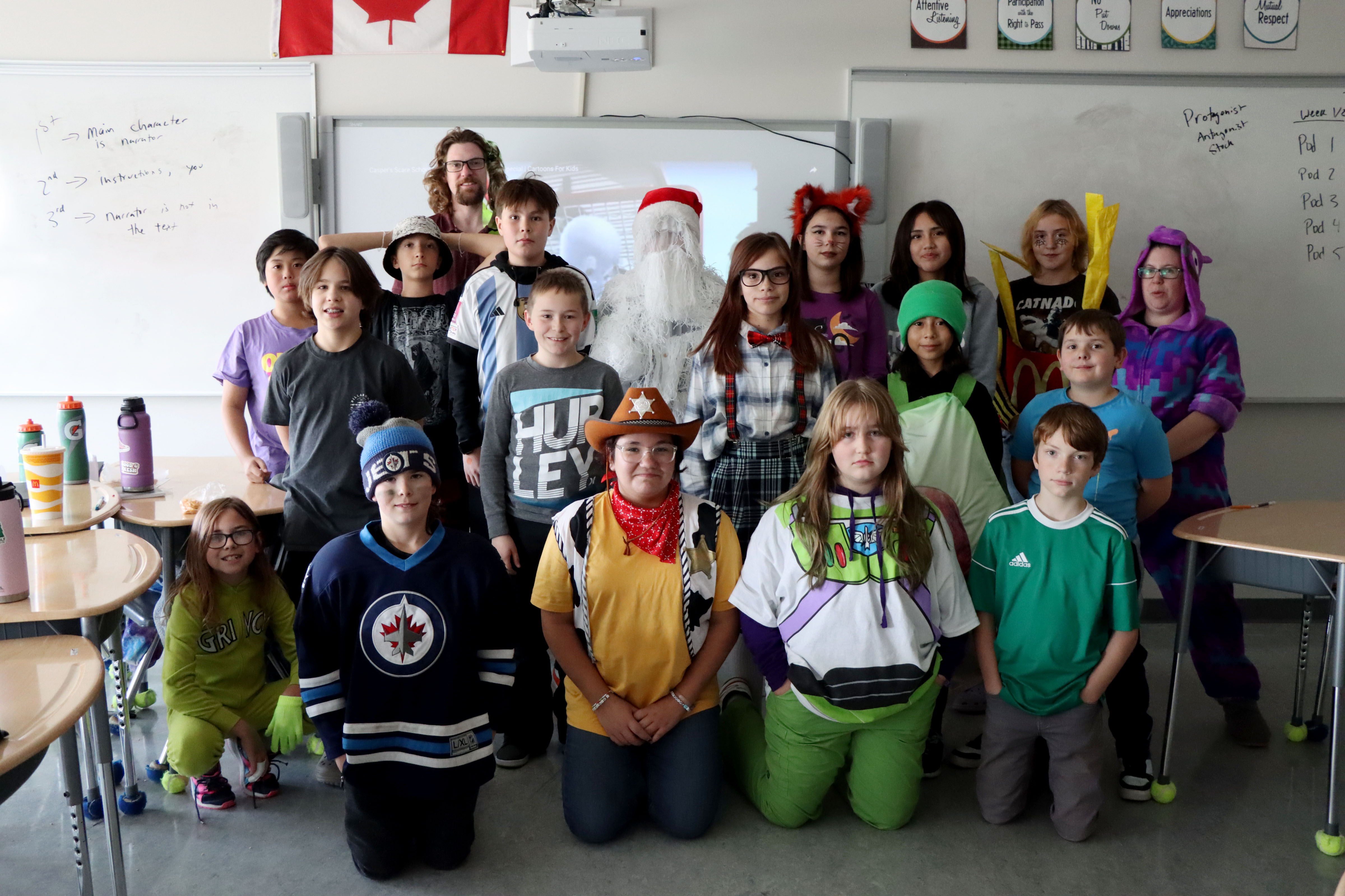 Students in costumes posing for a photo