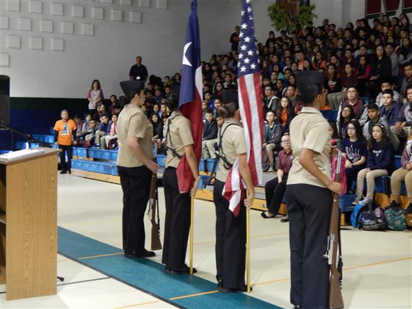 students carrying american flags