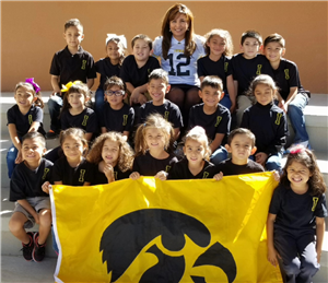 students with yellow flag