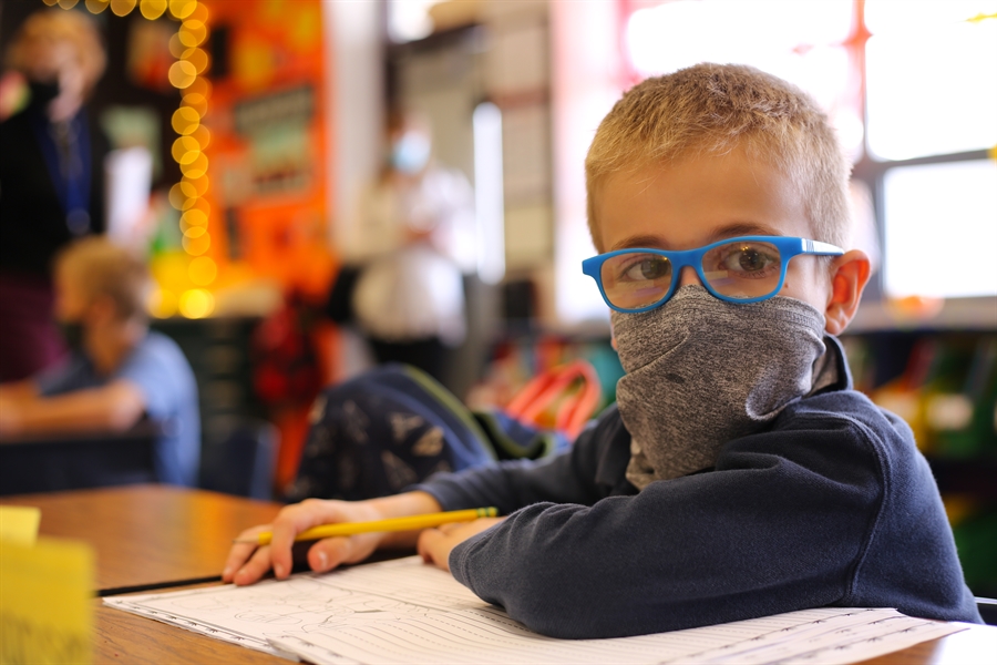 child sitting at desk