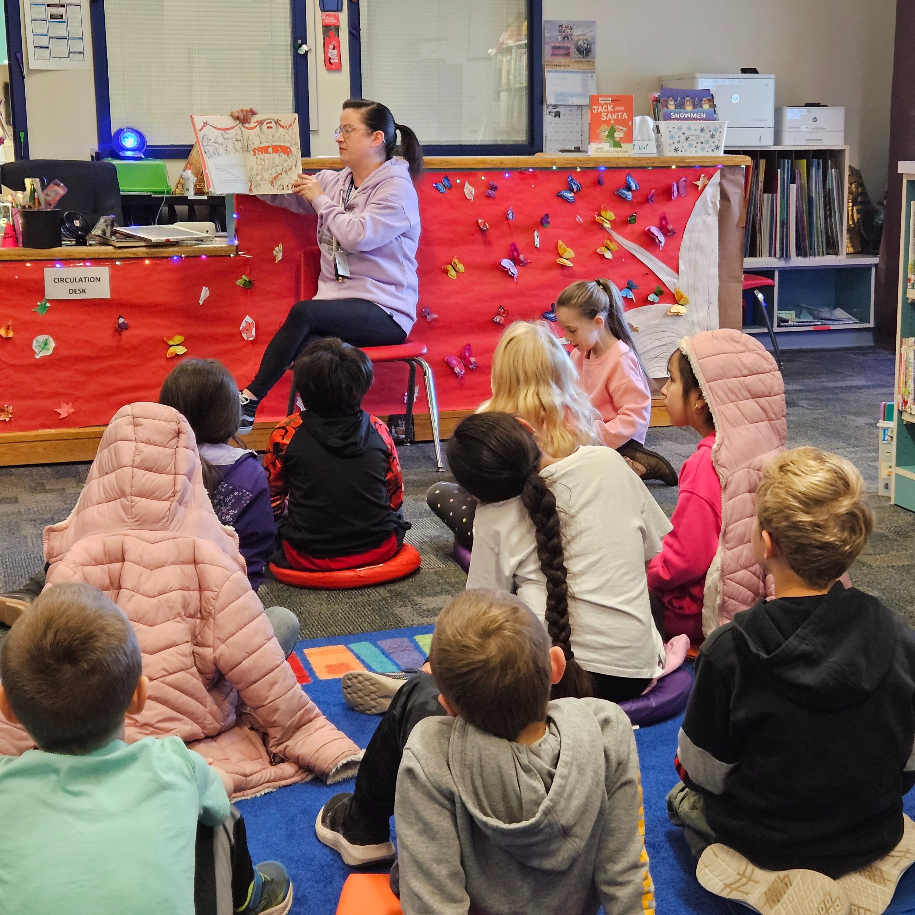 GBE Students listening to the librarian read a story!