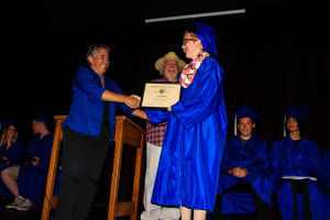 Graduating Seniors Accepting their Diplomas