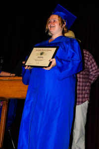 Graduating Senior Posing with Diploma