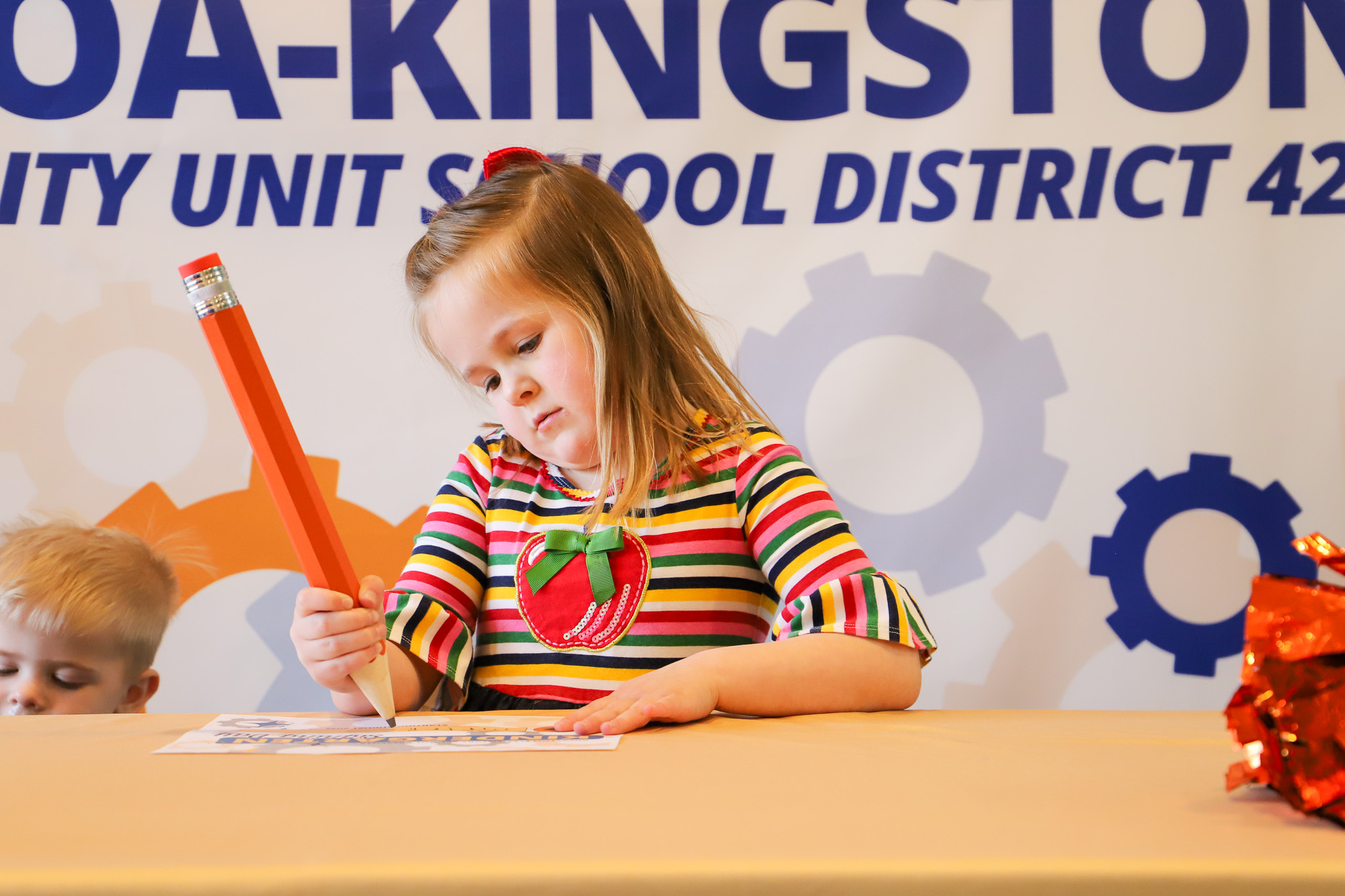 image of student signing paper