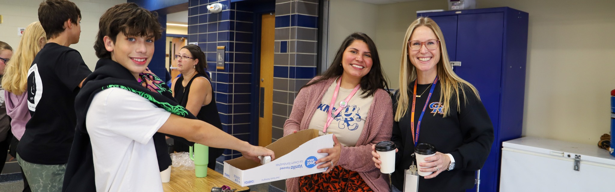 image of student and staff hanging out treats