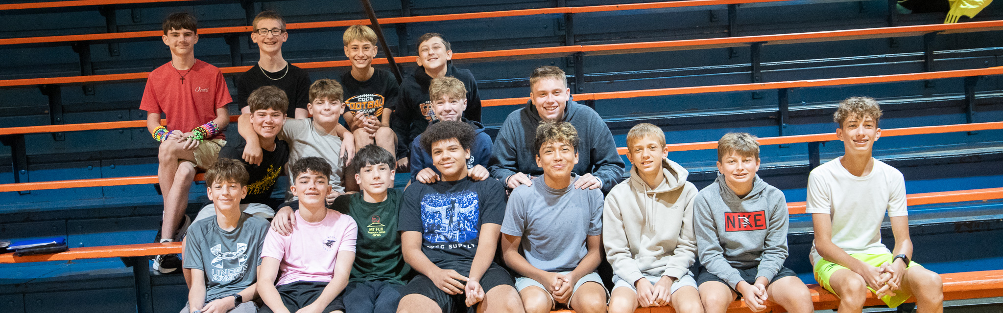 students sitting in gym