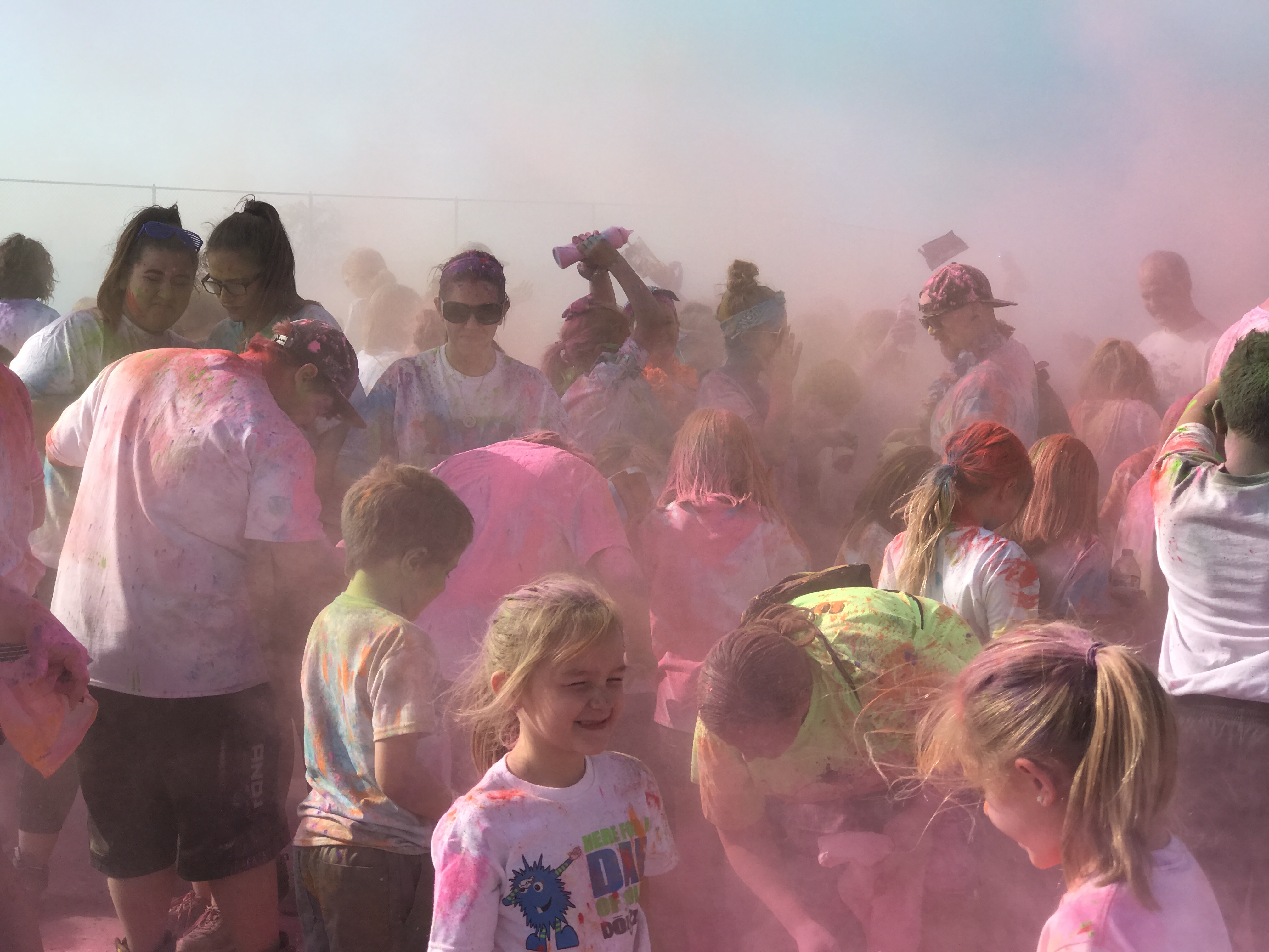 Big group of students colorfully painted from the Color Run