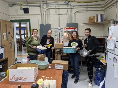 Staff displaying popcorn