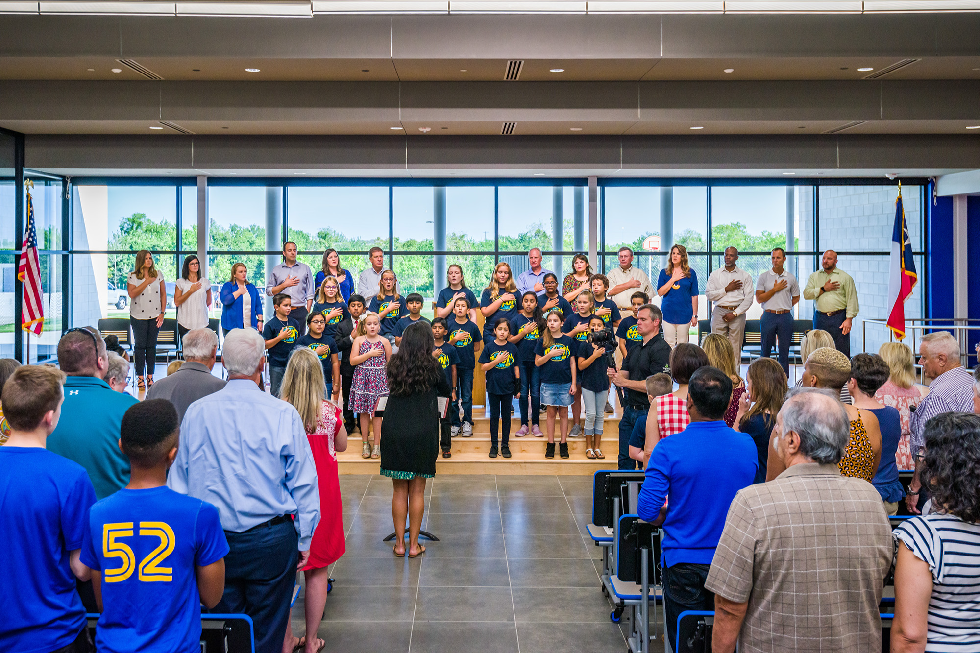 SIS students perform the National Anthem at the SIS grand opening.