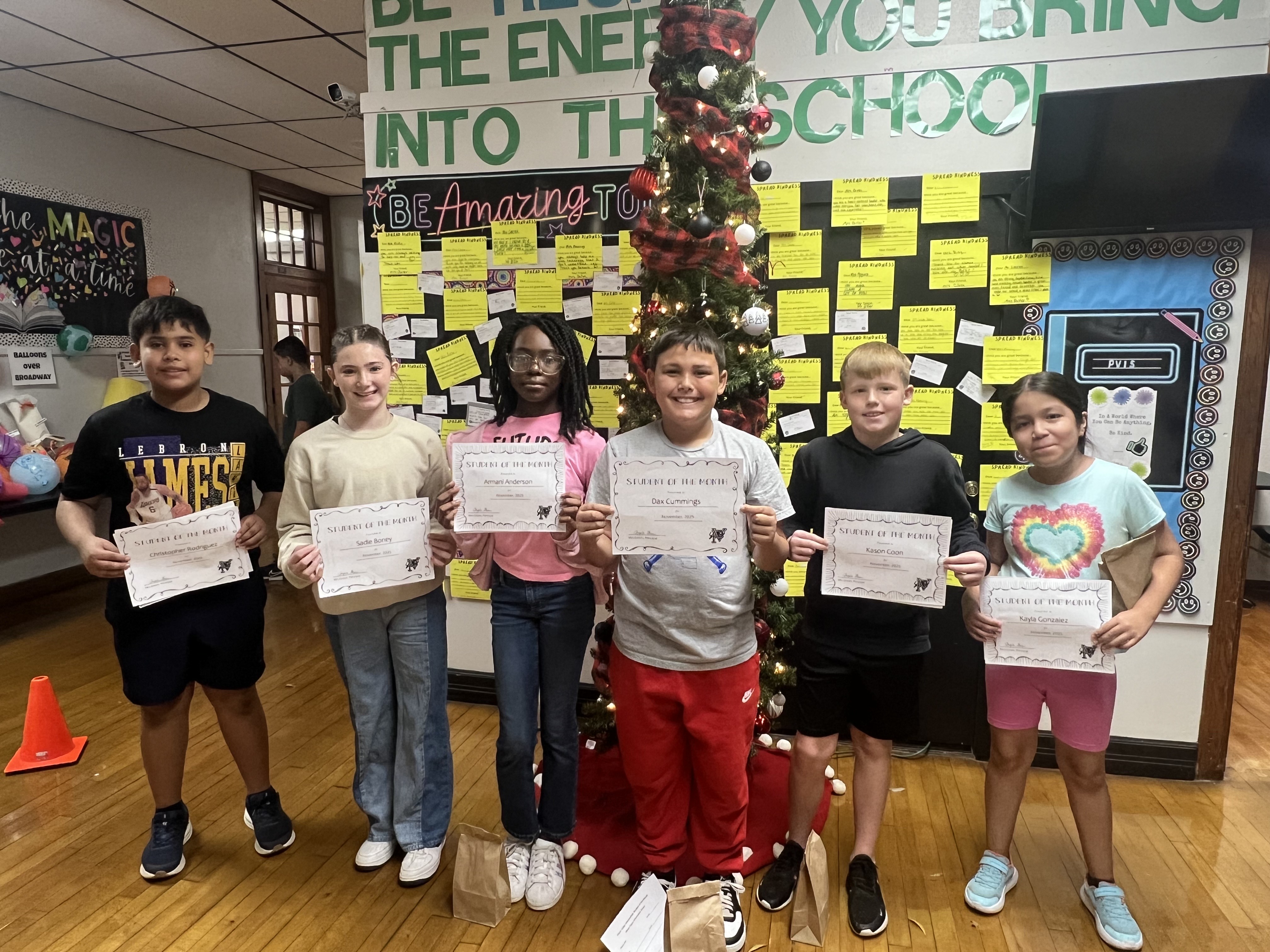 November students of the month pose for a picture