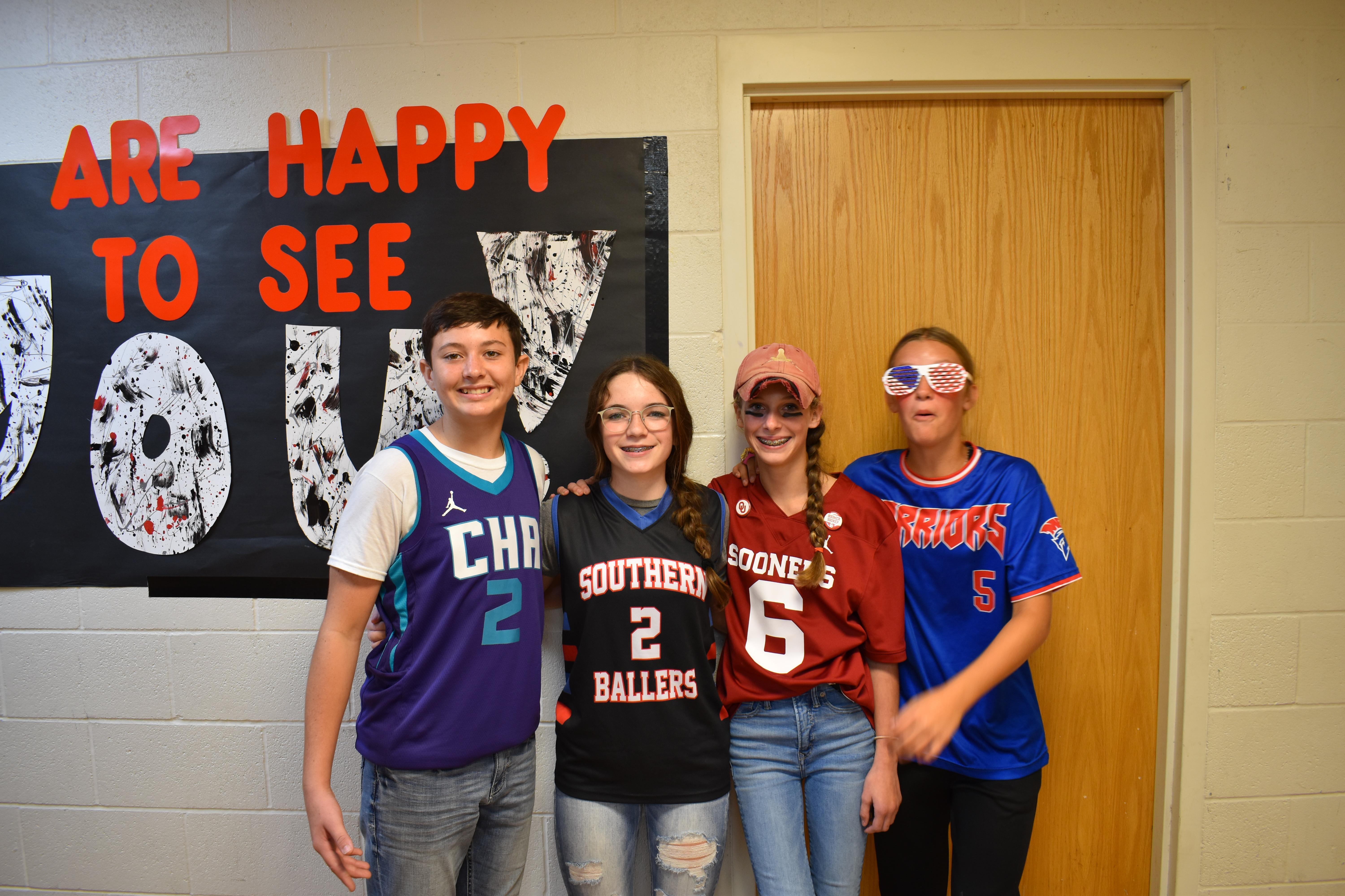 students and staff pose for photos