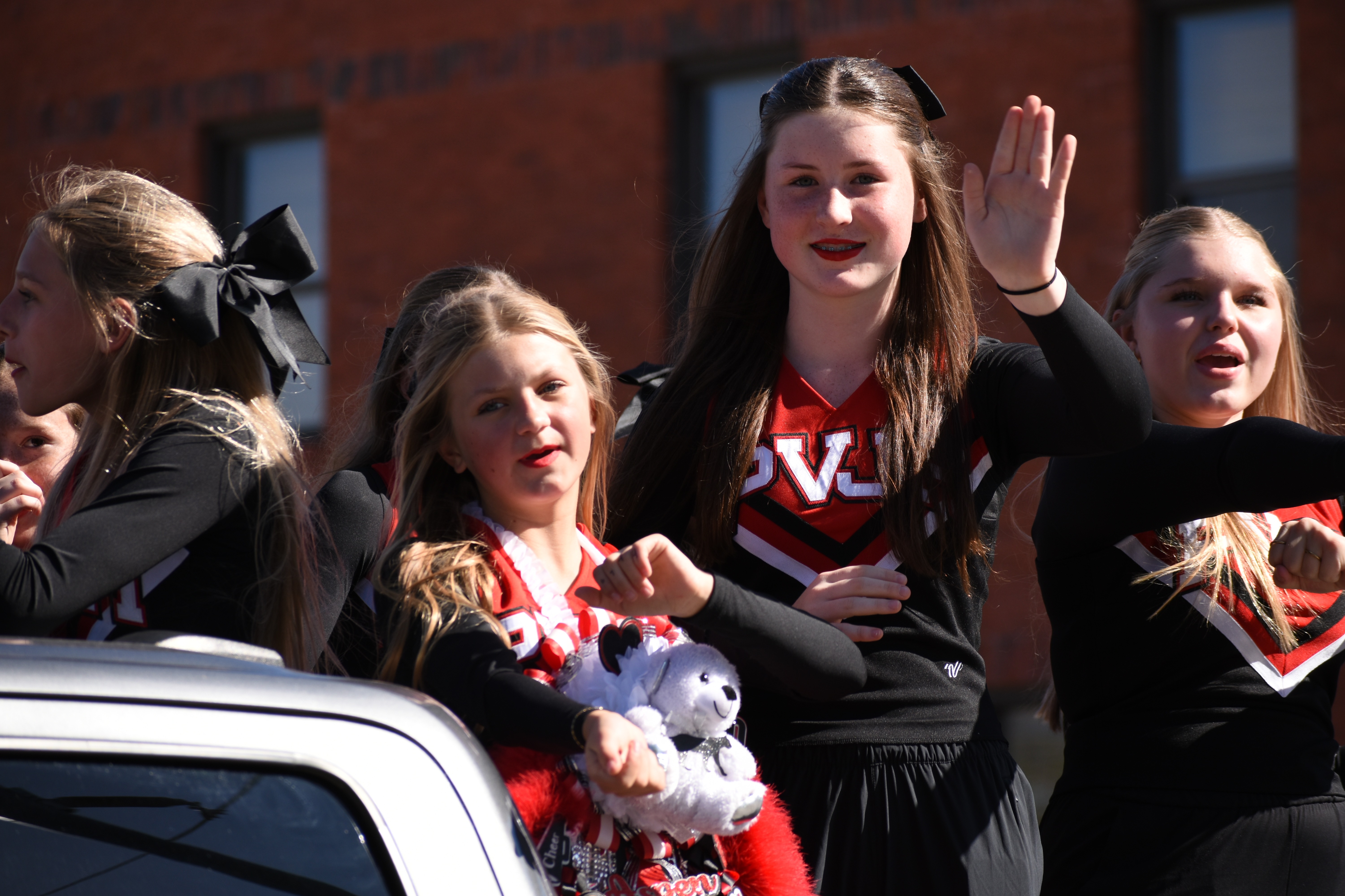 students and staff pose for photos