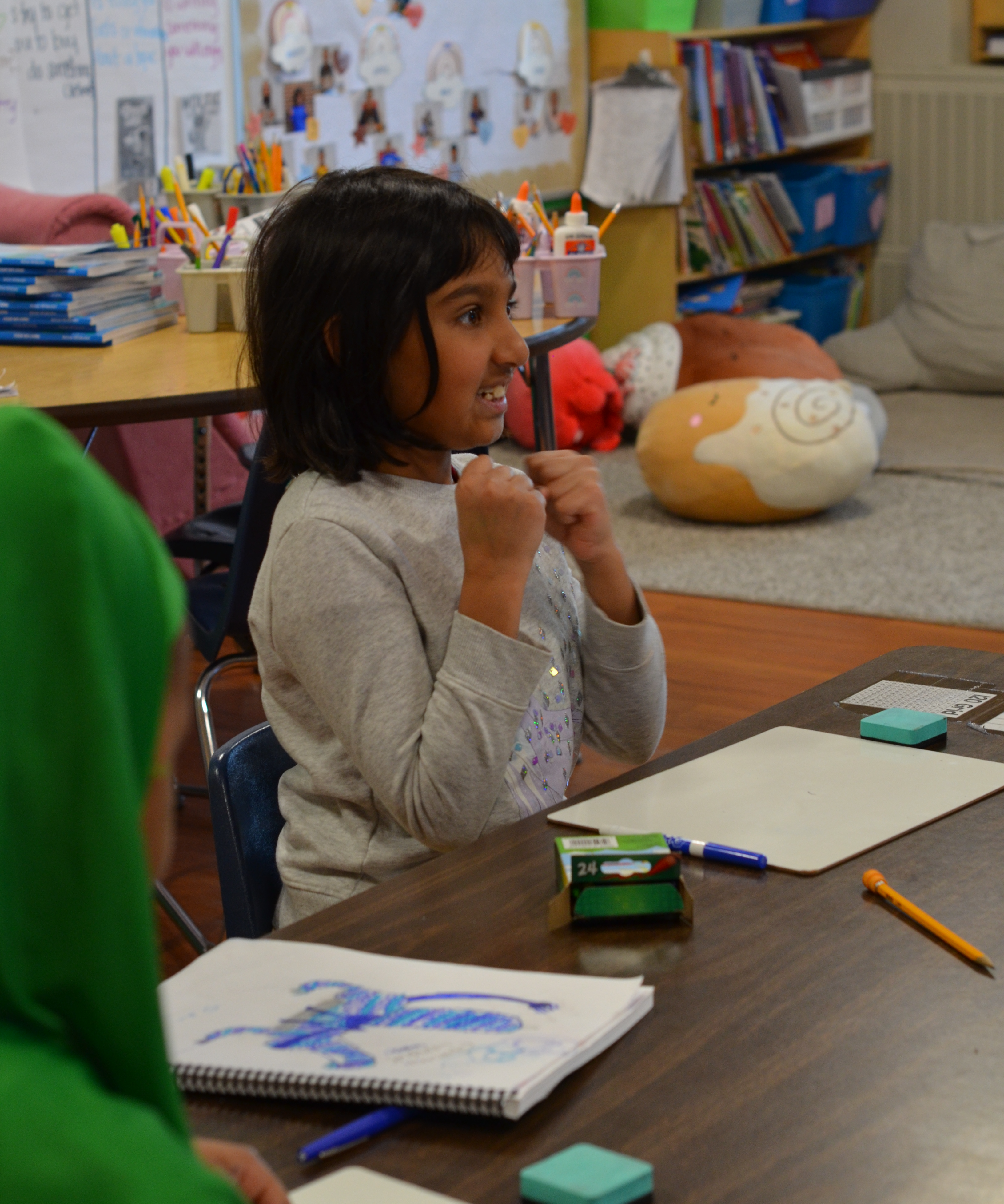 Young girl smiling at teacher