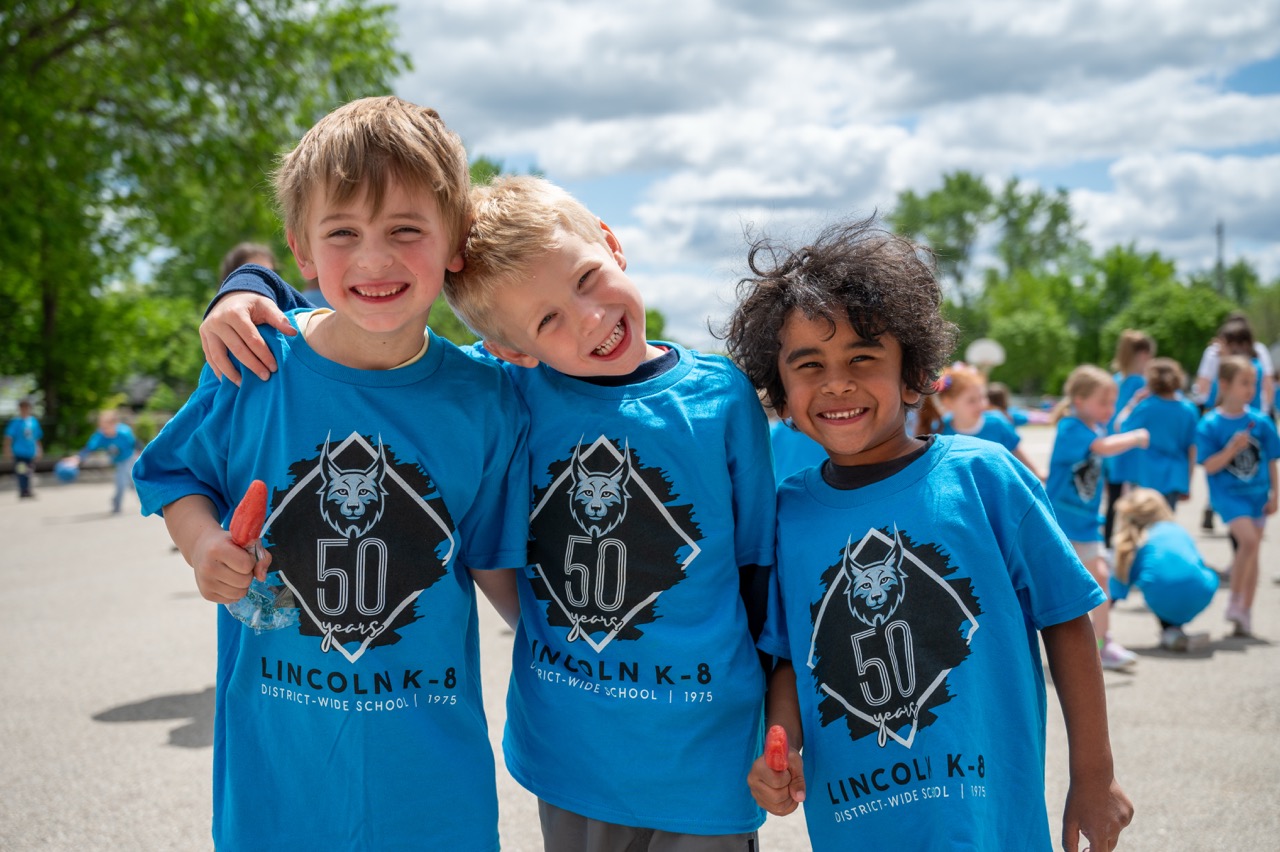 Lincoln students pose for a photo in their 50th anniversary tshirts