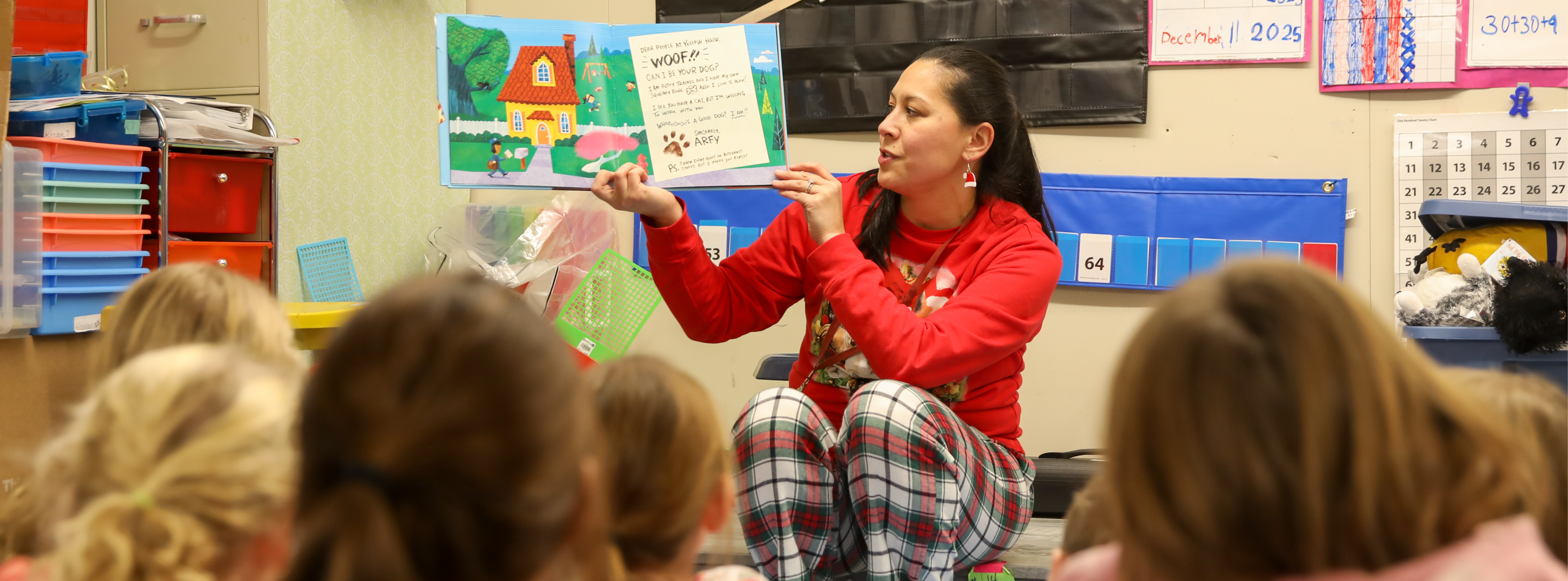 Teacher reading to the classroom.