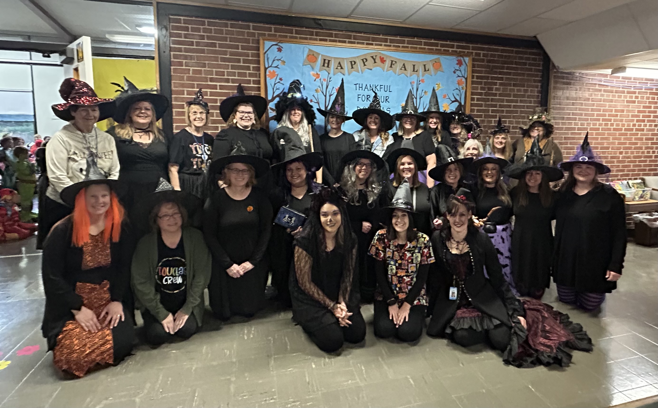 Douglas staff dressed up as witches for Halloween