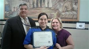 Carmen Rivera pictured with Kevin Eberle, Chief Operations Office and Ellen Dunne, Principal of Riverside High School