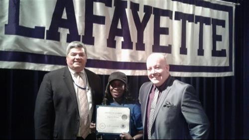 Eugenia Thomas pictured with Kevin Eberle, Chief Operation Officer and John Starkey, Principal of Lafayette High School