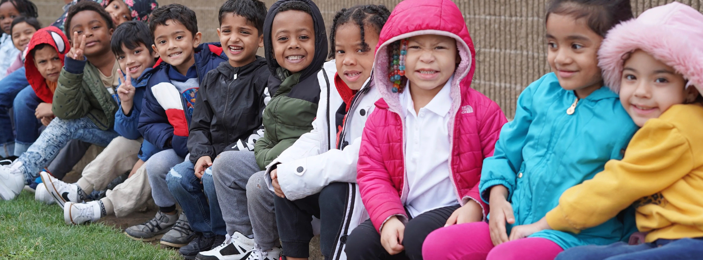 Group of Young students ouside smiling