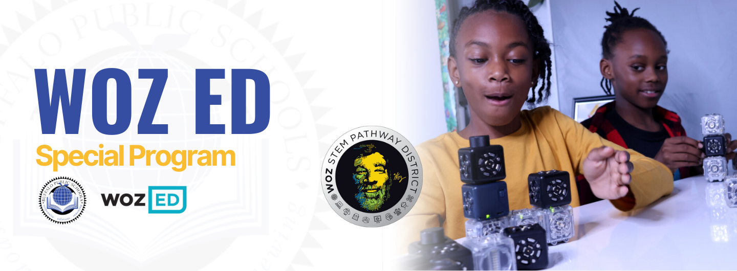 Woz ED Banner with picture of girls playing with Cubes