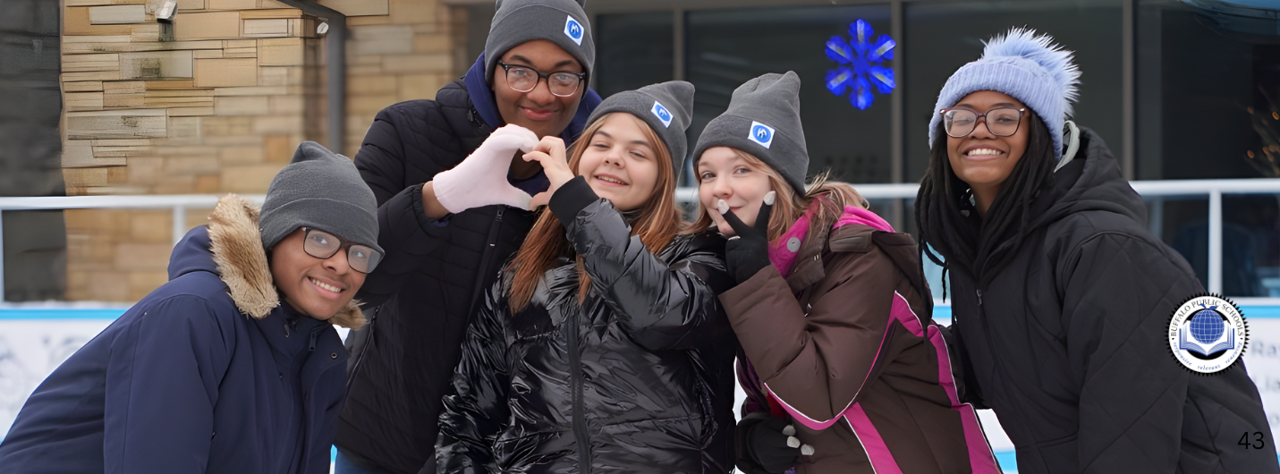 Students Ice Skating giving heart hand sign
