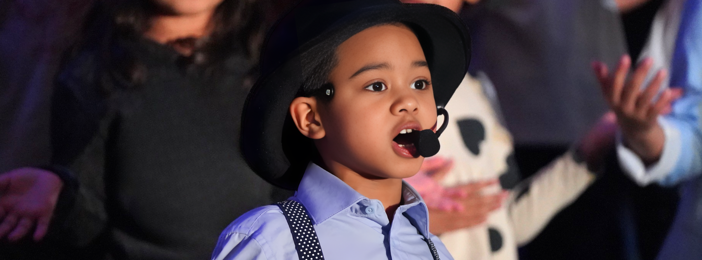 Young Boy Singing in a Performance 