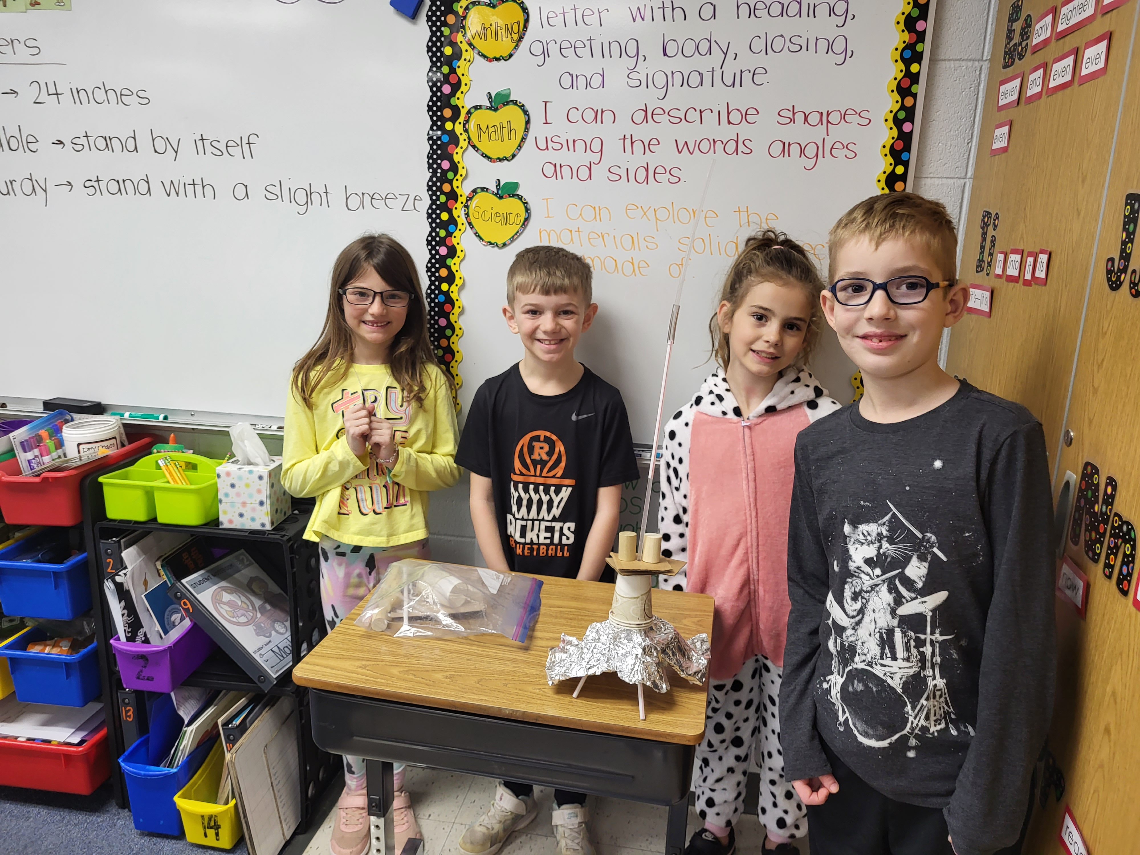 2nd Graders displaying a homemade Rockets